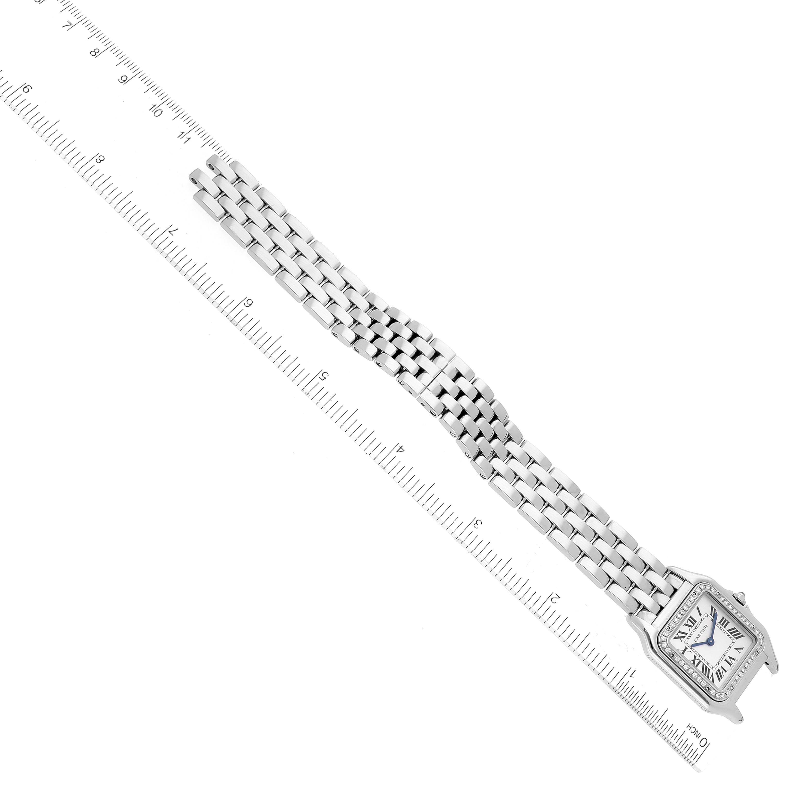 The image shows the Panthere model by Cartier at a top-down angle, highlighting the face and full length of the bracelet laid next to a ruler.