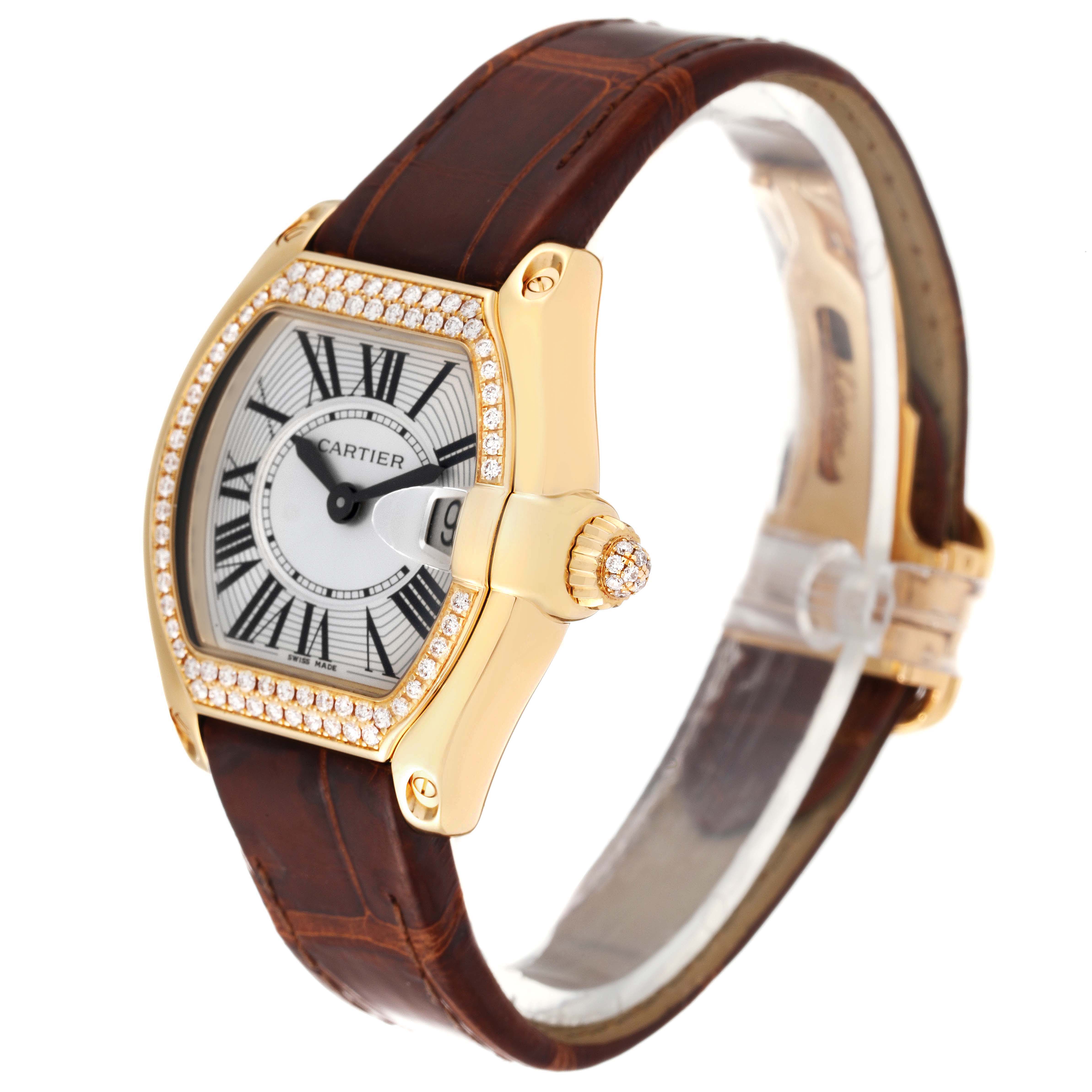 The Cartier Roadster WE500160 Women's Yellow Gold Silver Dial WE500160 Women's Yellow Gold Silver Dial watch is shown at a slight angle, displaying the face, bezel, crown, and part of the leather strap.