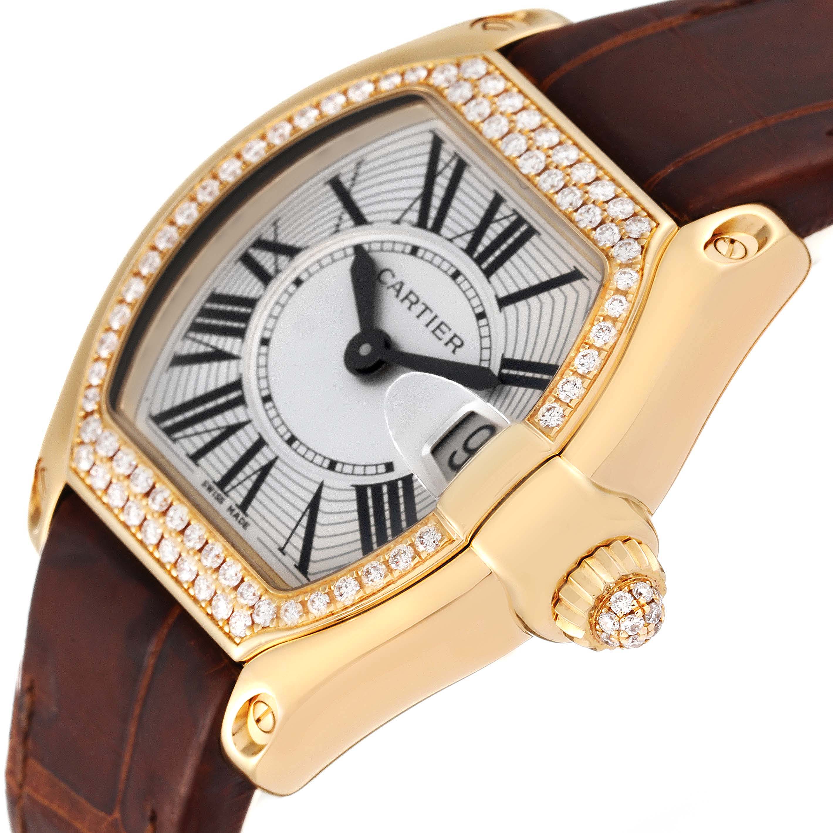 The Cartier Roadster WE500160 Women's Yellow Gold Silver Dial WE500160 Women's Yellow Gold Silver Dial watch is shown at an angled view, highlighting its diamond-studded bezel, dial, crown, and leather strap.