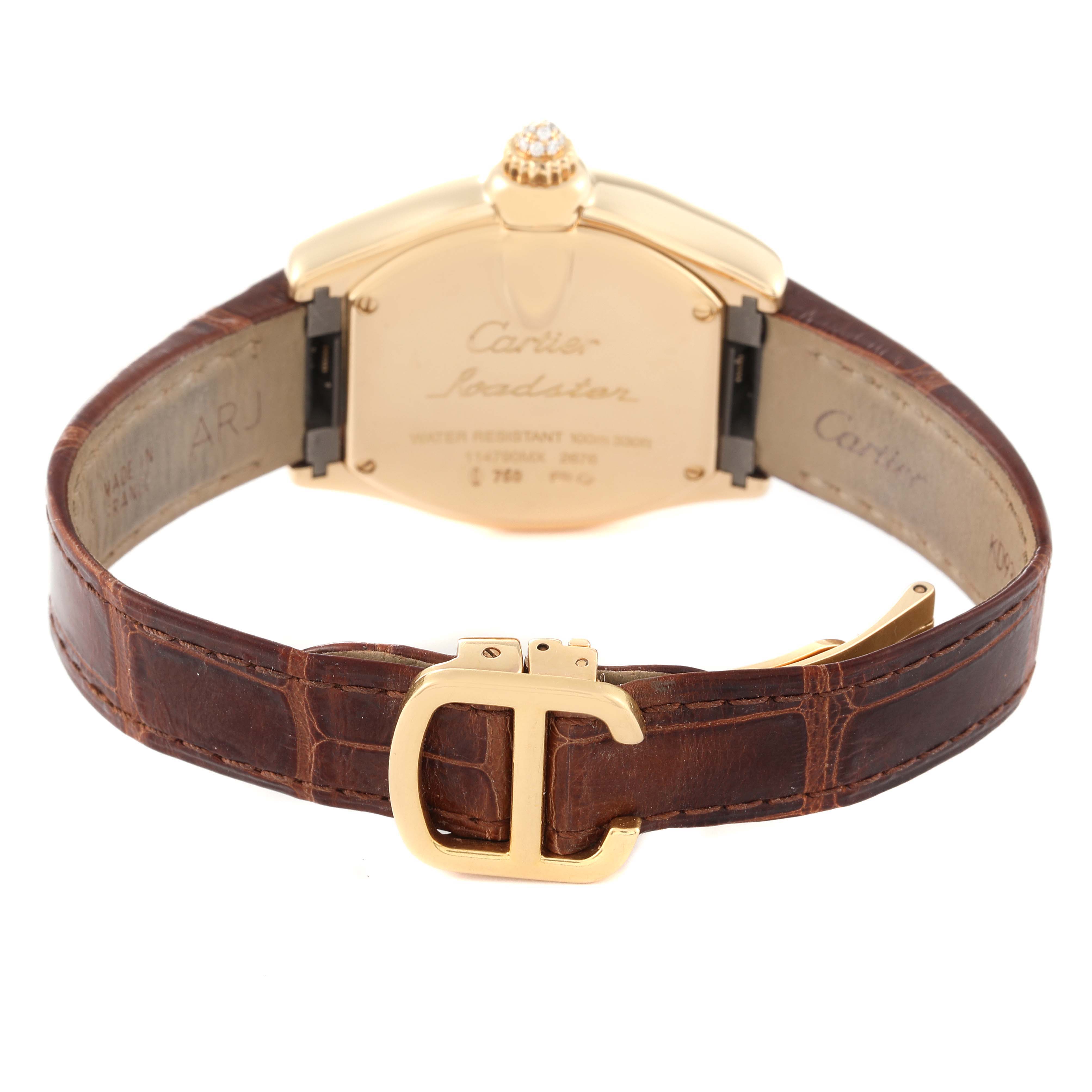 The image shows the back of a Cartier Roadster WE500160 Women's Yellow Gold Silver Dial WE500160 Women's Yellow Gold Silver Dial watch with a brown leather strap and gold buckle.