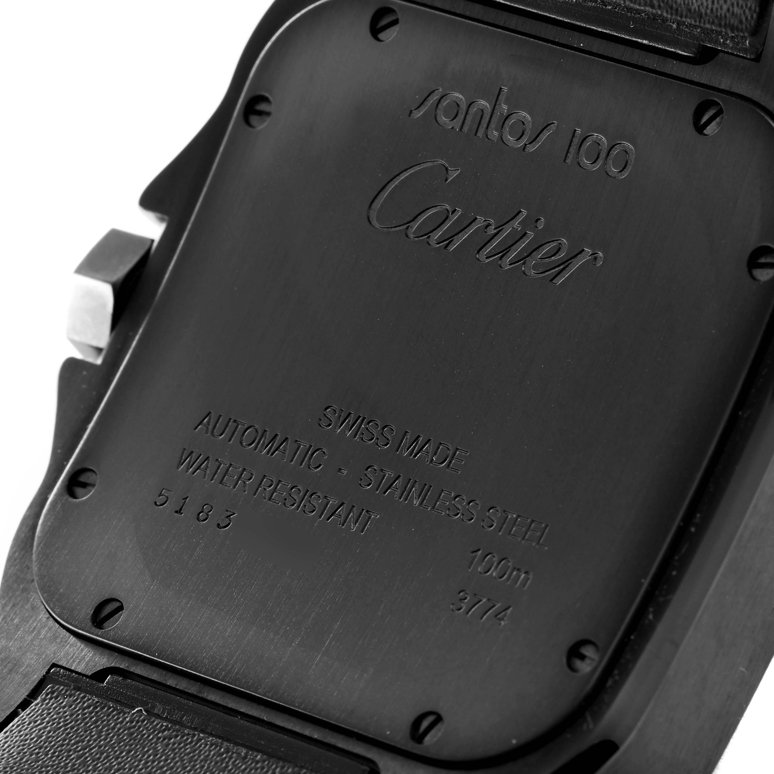 The image shows the back case of a Cartier Santos WSSA0006 Men
s Stainless Steel Black Dial WSSA0006 Men
s Stainless Steel Black Dial 100 watch, highlighting its engravings and screws.