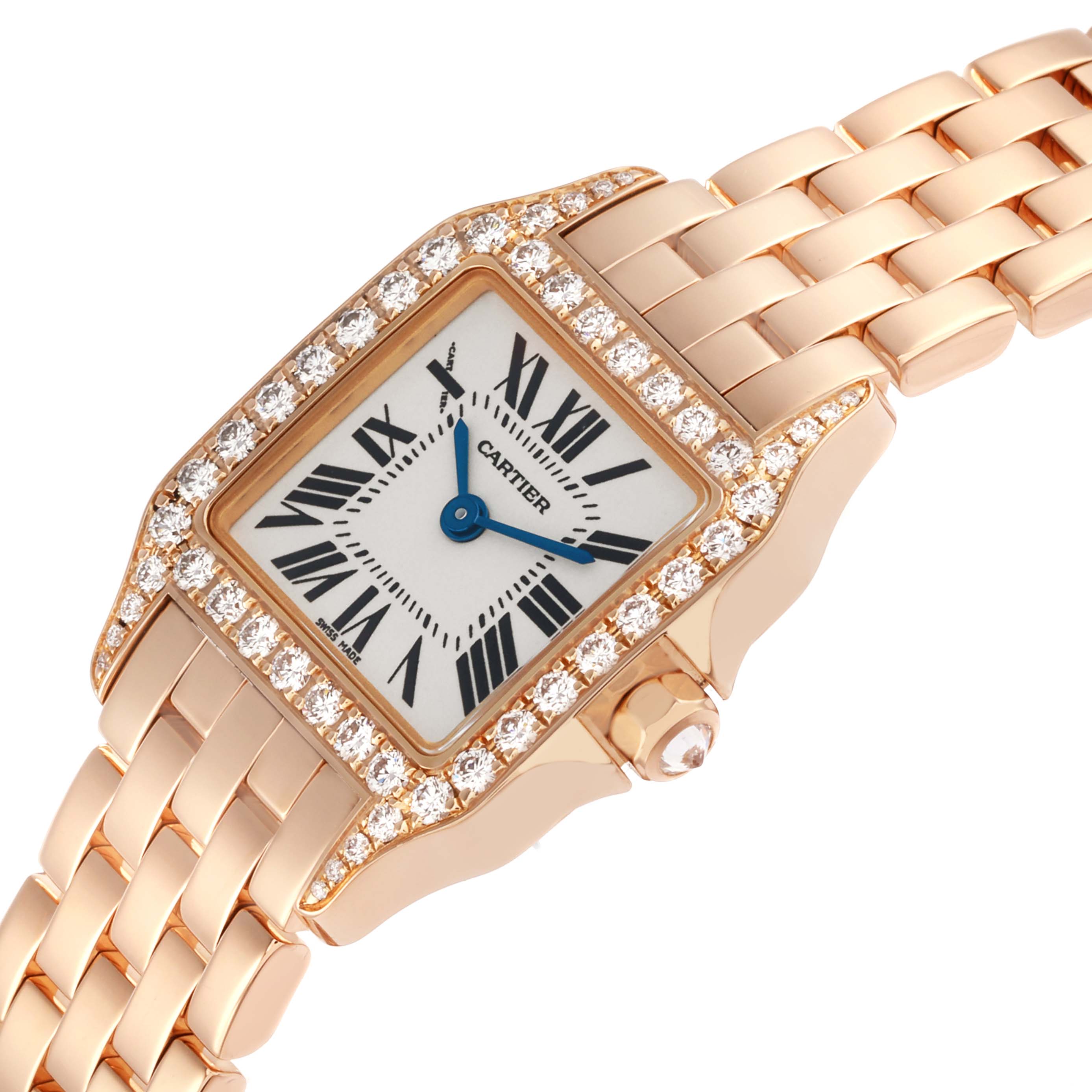 The Cartier Santos Demoiselle WF9011Z8 Women's Rose Gold Silver Dial watch is shown from a top angle, highlighting its diamond-studded bezel, face, and linked bracelet.