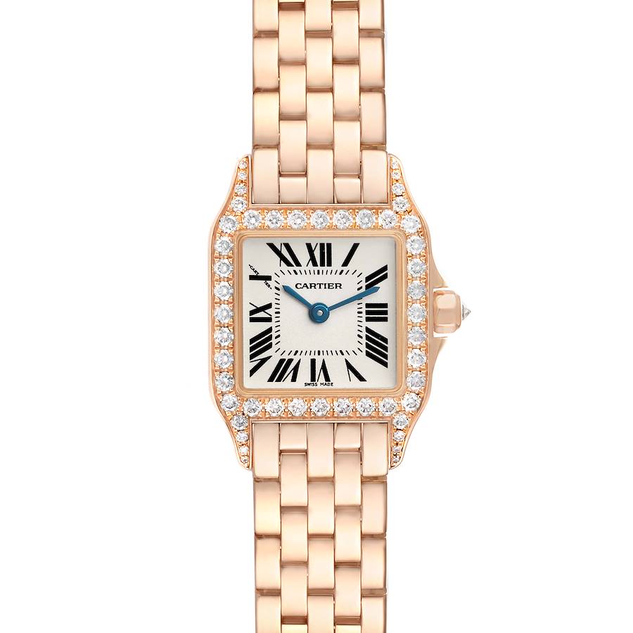 The Cartier Santos Demoiselle WF9011Z8 Women's Rose Gold Silver Dial watch is shown from a top-down angle, highlighting its diamond-studded bezel, face, and gold bracelet.