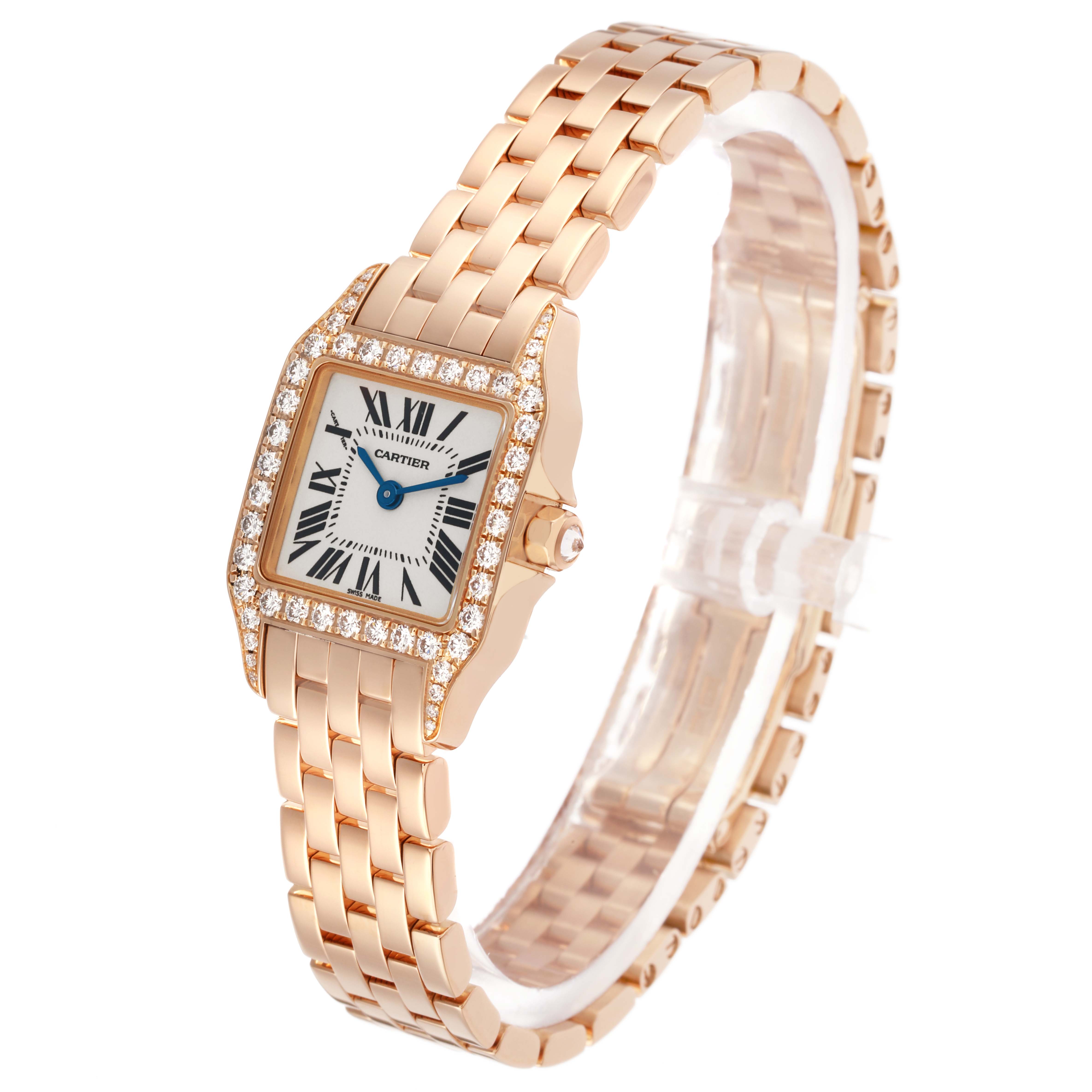The Cartier Santos Demoiselle WF9011Z8 Women's Rose Gold Silver Dial watch is shown at an angle highlighting the face, diamond-encrusted bezel, and gold bracelet.