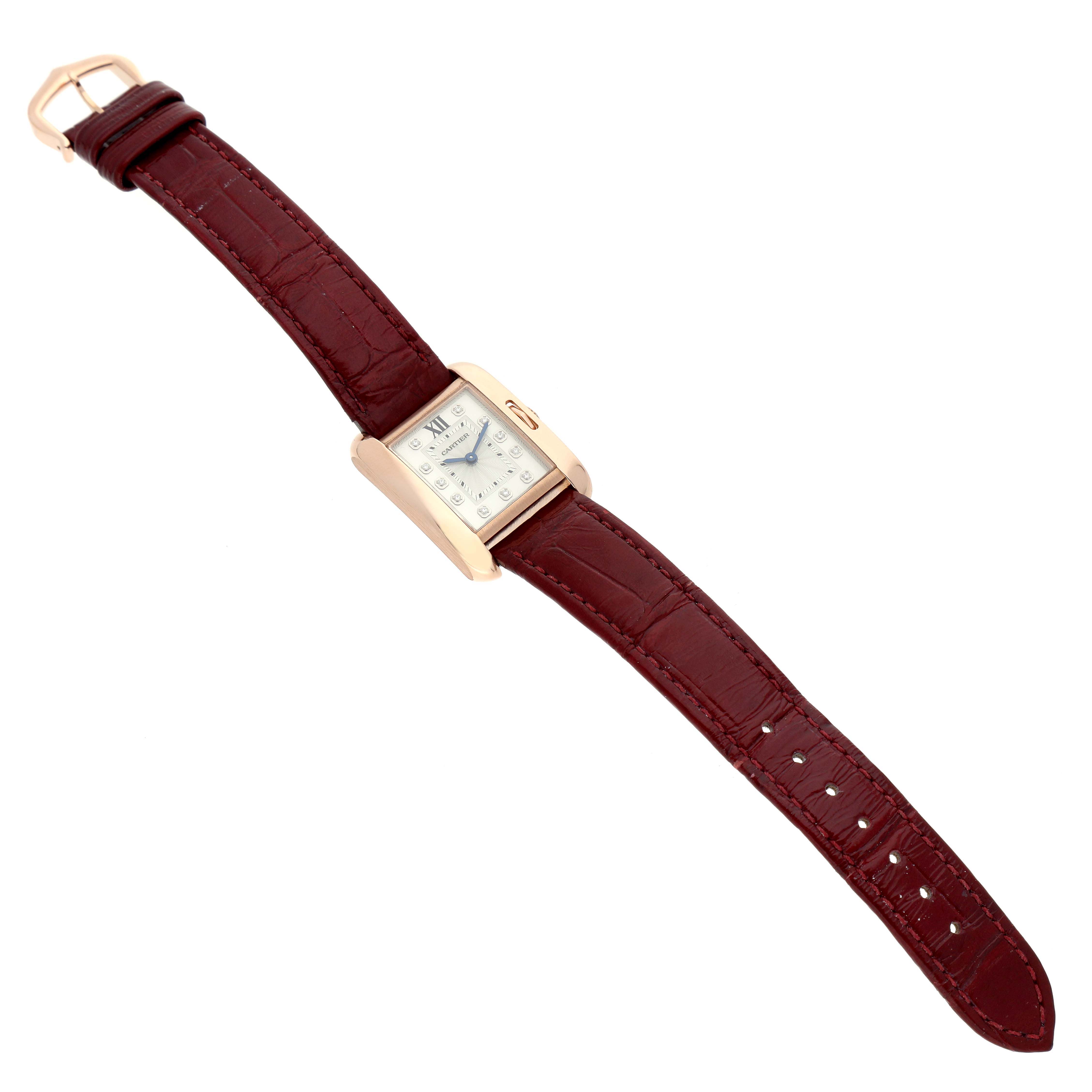The Cartier Tank Anglaise WJTA0007 Women's Rose Gold Silver Dial watch is shown at a slight angle, highlighting the watch face, case, and full burgundy leather strap.