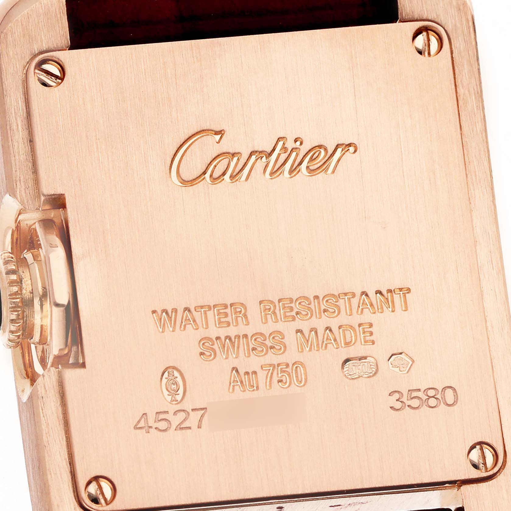 The image shows the back of the Cartier Tank Anglaise WJTA0007 Women's Rose Gold Silver Dial watch, highlighting its gold material and engraved details.