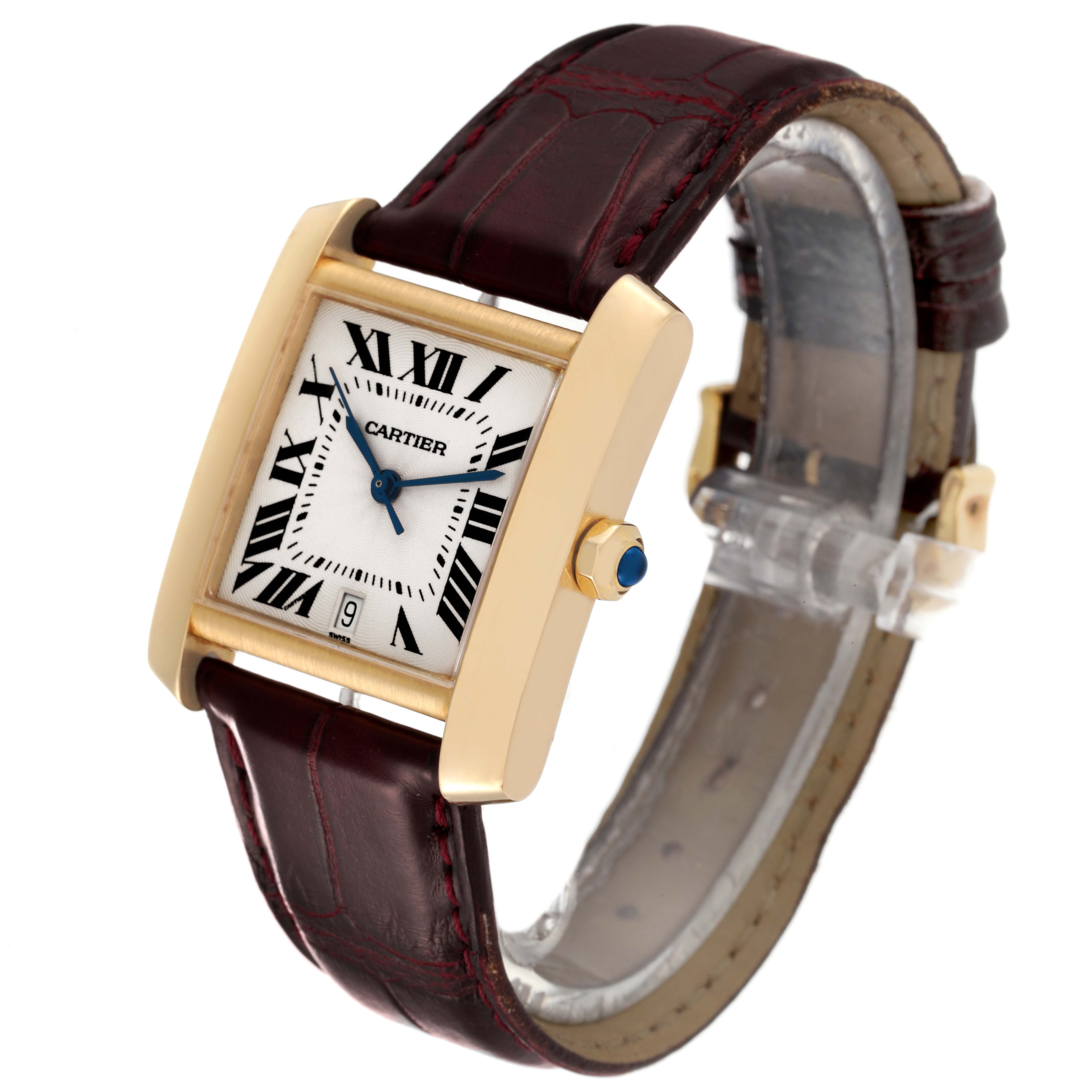 The image shows a Cartier Tank Française watch from an oblique angle, highlighting its rectangular face, gold case, and brown leather strap.