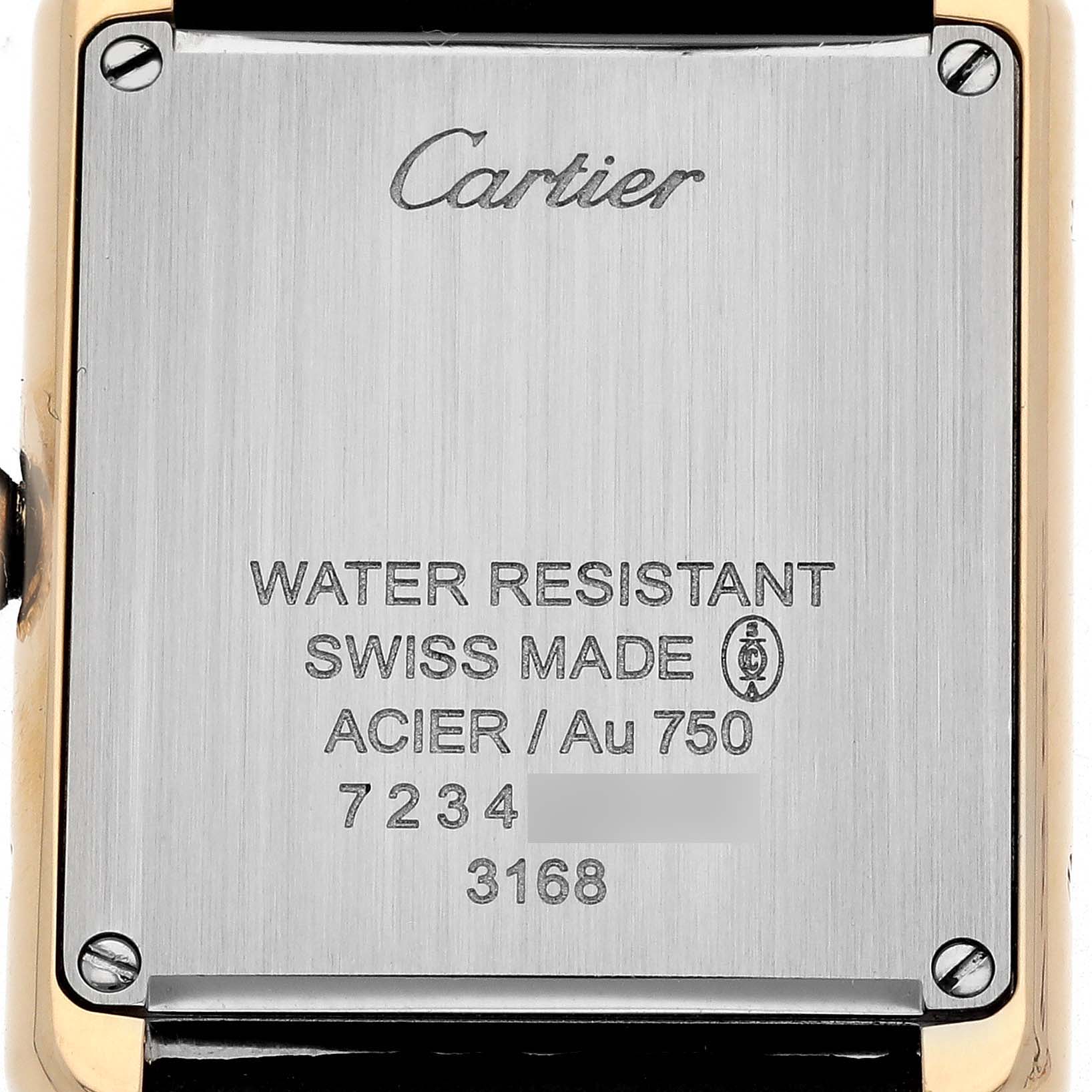 The image shows the back of the Cartier Tank Solo W5200002 Women's Yellow Gold Silver Dial watch, featuring brand engravings and production details.
