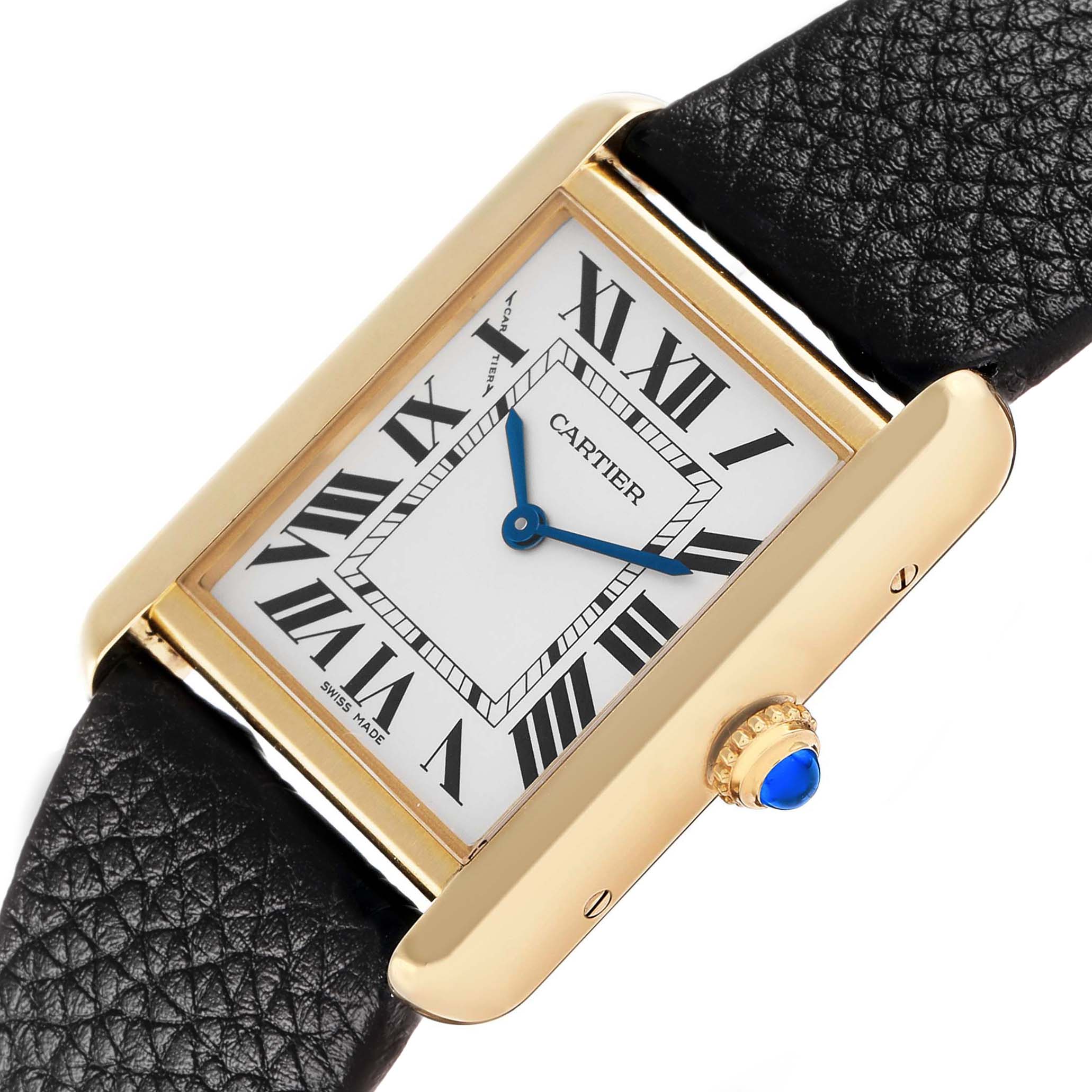The Cartier Tank Solo W5200002 Women's Steel and Gold (two tone) Silver Dial watch is shown at an angled close-up, highlighting the face, Roman numerals, gold case, and crown with a blue gem.