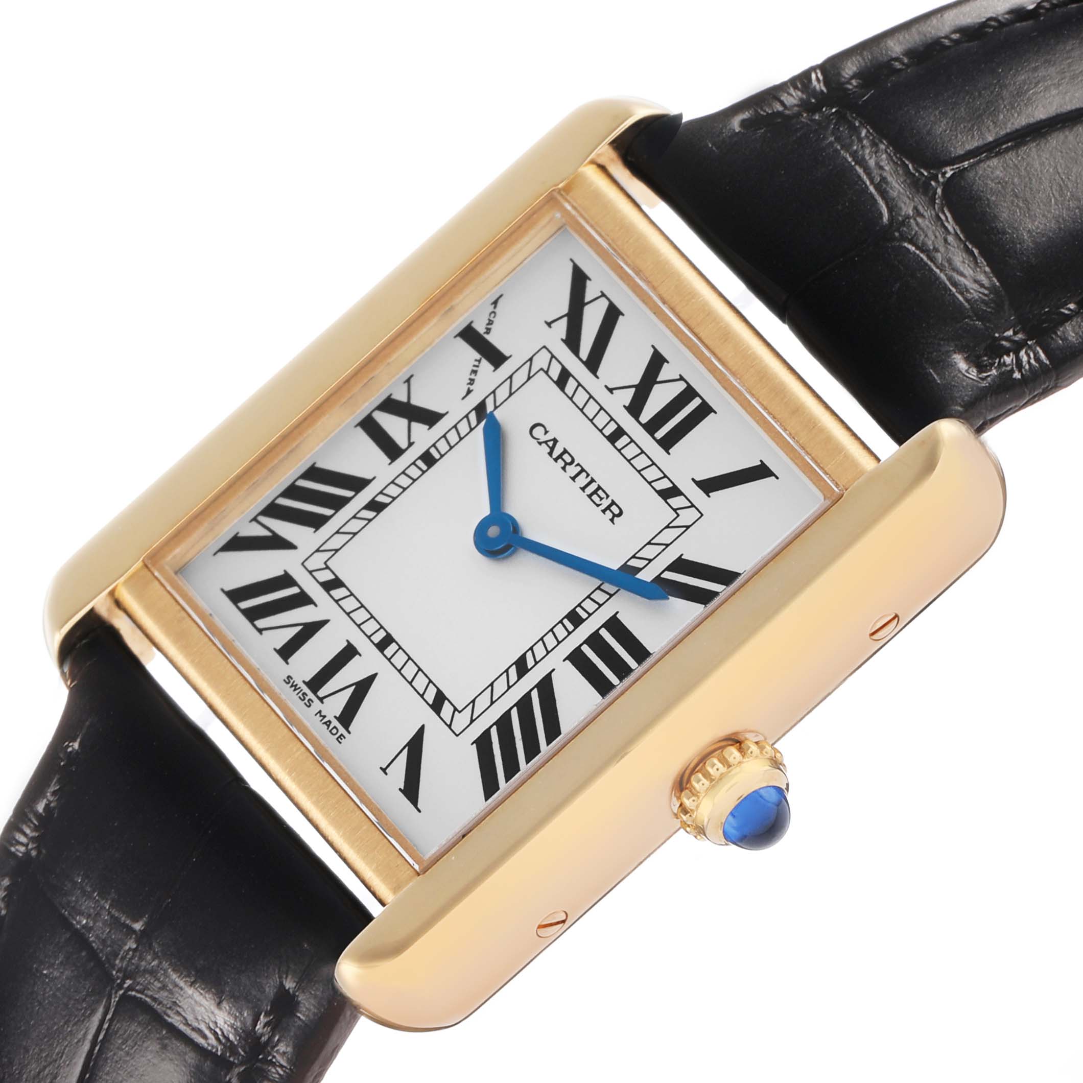 The Cartier Tank Solo W5200002 Women's Yellow Gold Silver Dial watch is shown at a slight angle, highlighting the dial, crown with a blue cabochon, and leather strap.