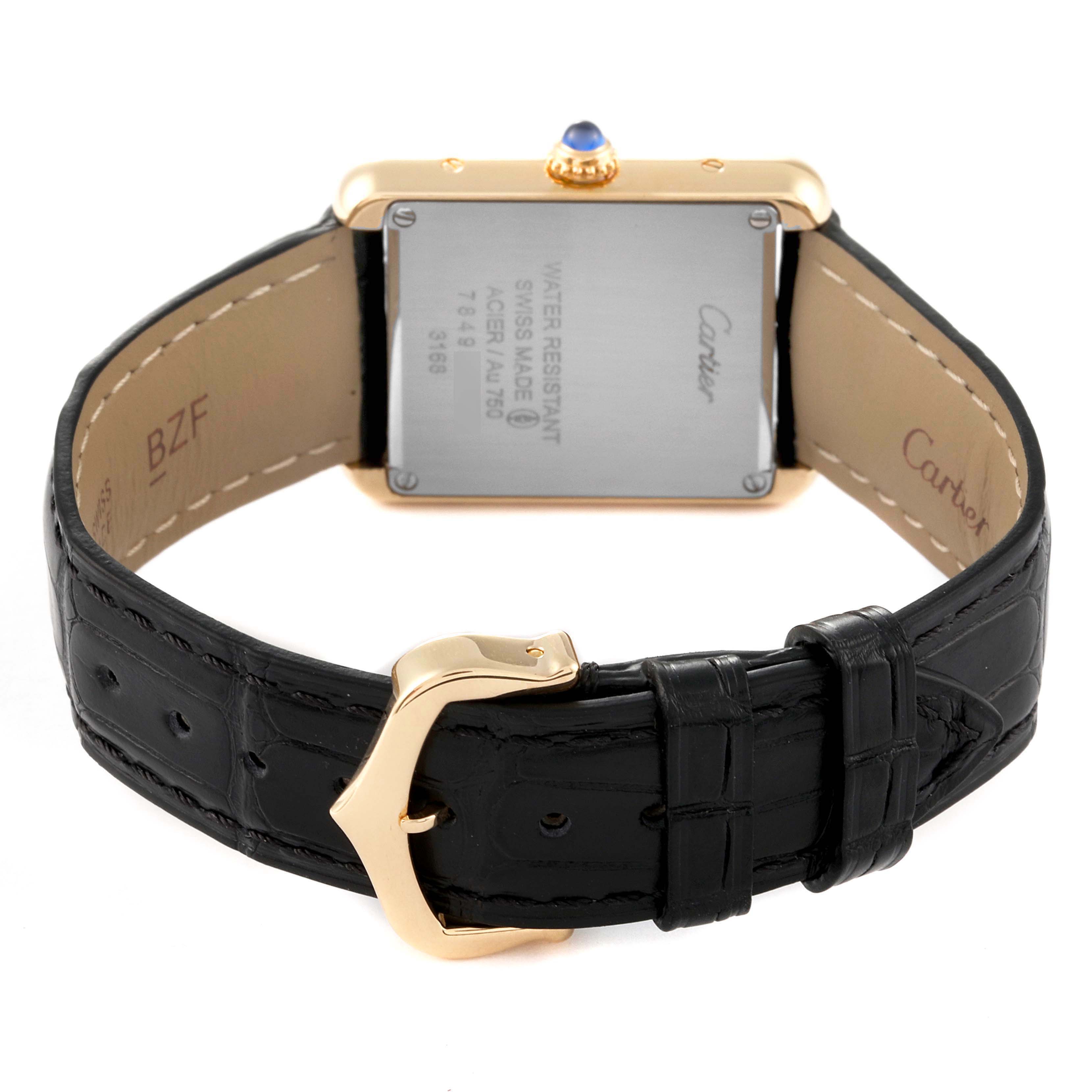 The image shows the back of a Cartier Tank Solo W5200002 Women's Yellow Gold Silver Dial W5200002 Women's Yellow Gold Silver Dial watch, showcasing the clasp, strap, and case back.