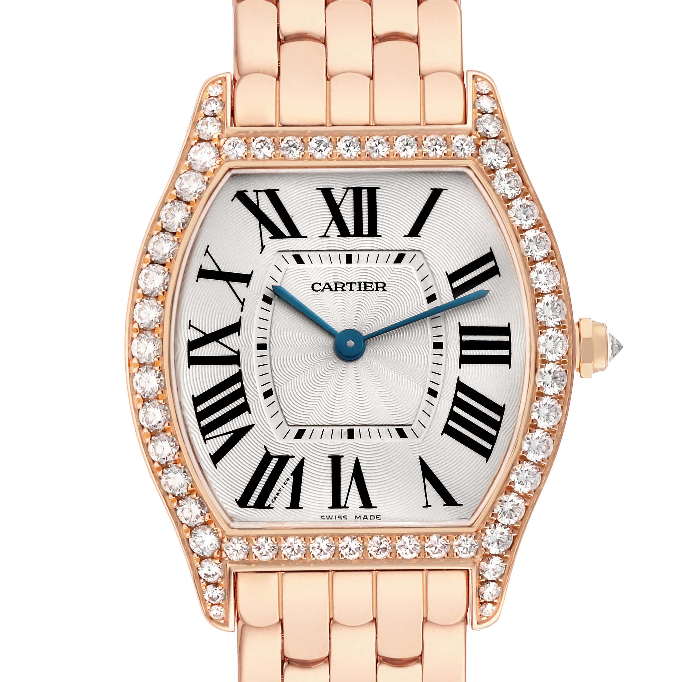 The Cartier Tortue WA501012 Women's Rose Gold Silver Dial watch is shown from the front, featuring a diamond-encrusted bezel, Roman numerals, and a metal bracelet.