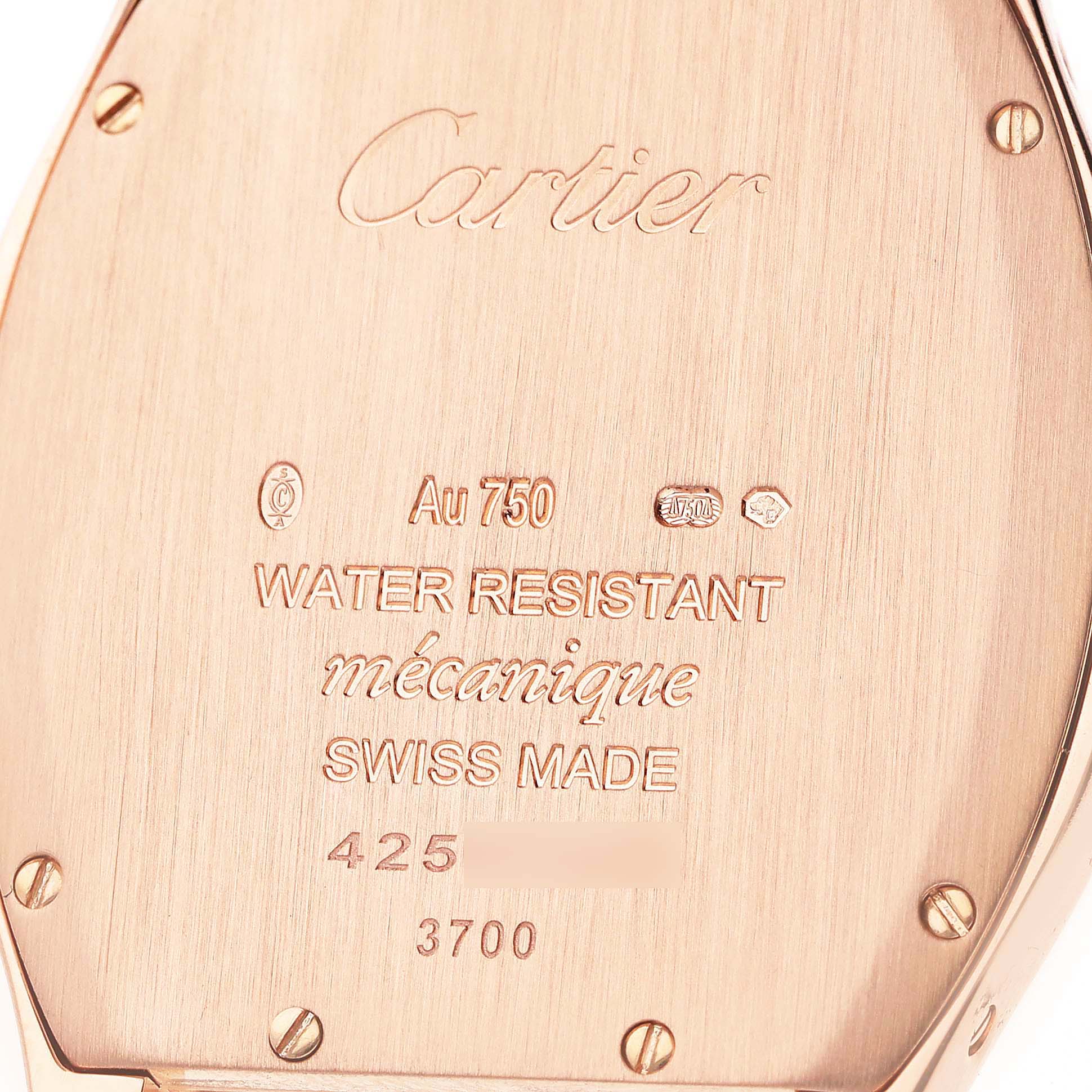The image shows the back case of a Cartier Tortue WA501012 Women's Rose Gold Silver Dial watch, displaying engravings and hallmarks.