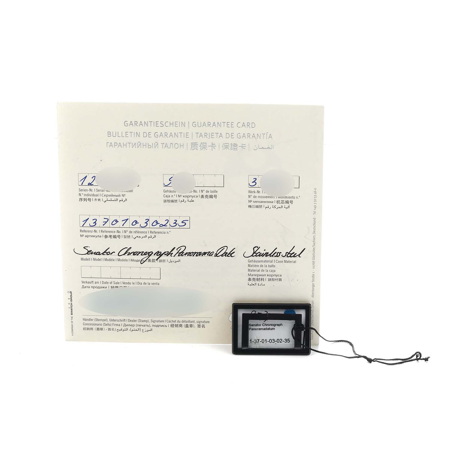 The image shows the guarantee card and tag for the Glashütte Senator Chronograph Panorama Date.