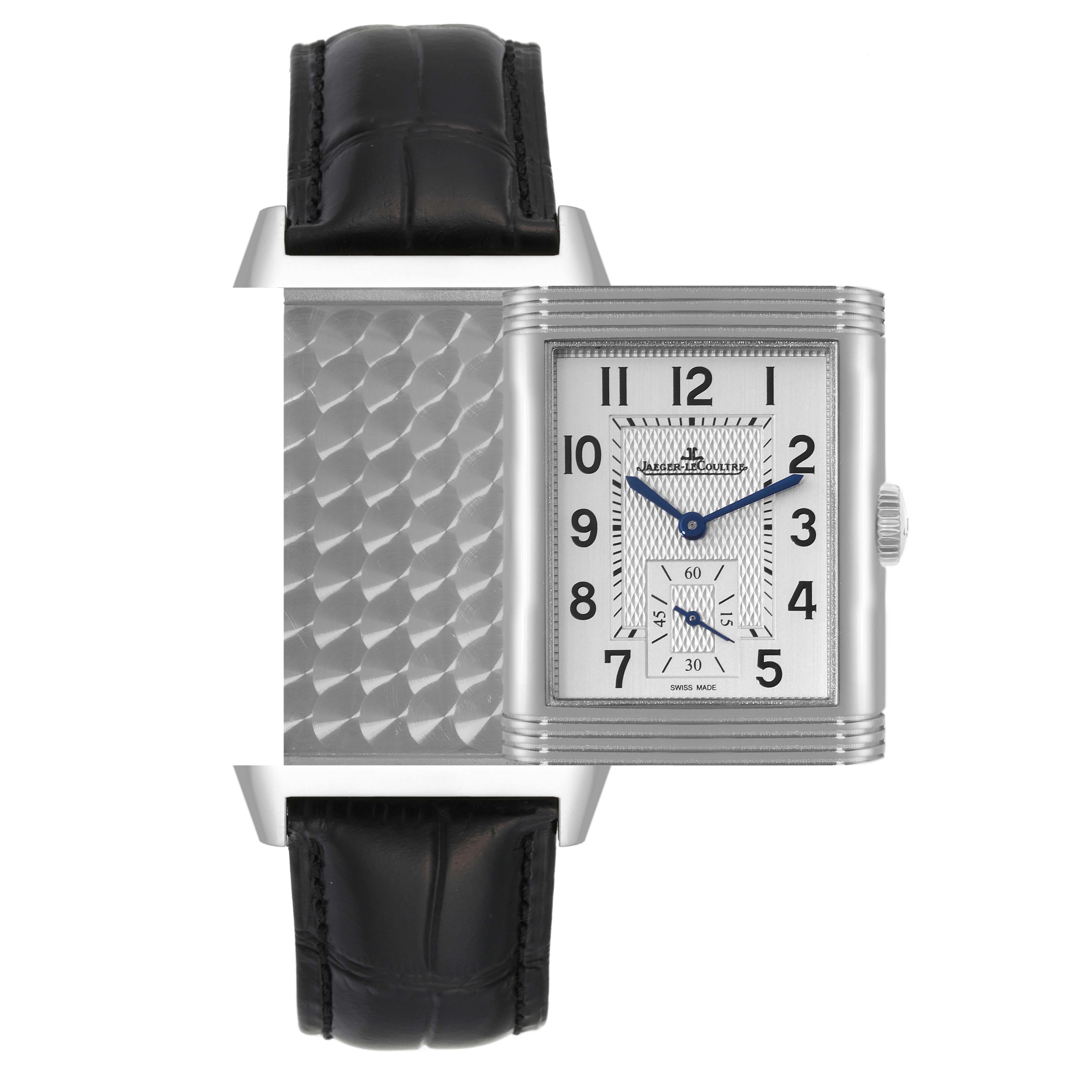 The image shows a Jaeger-LeCoultre Reverso watch with its case partially flipped to reveal both the dial and the reverse side.