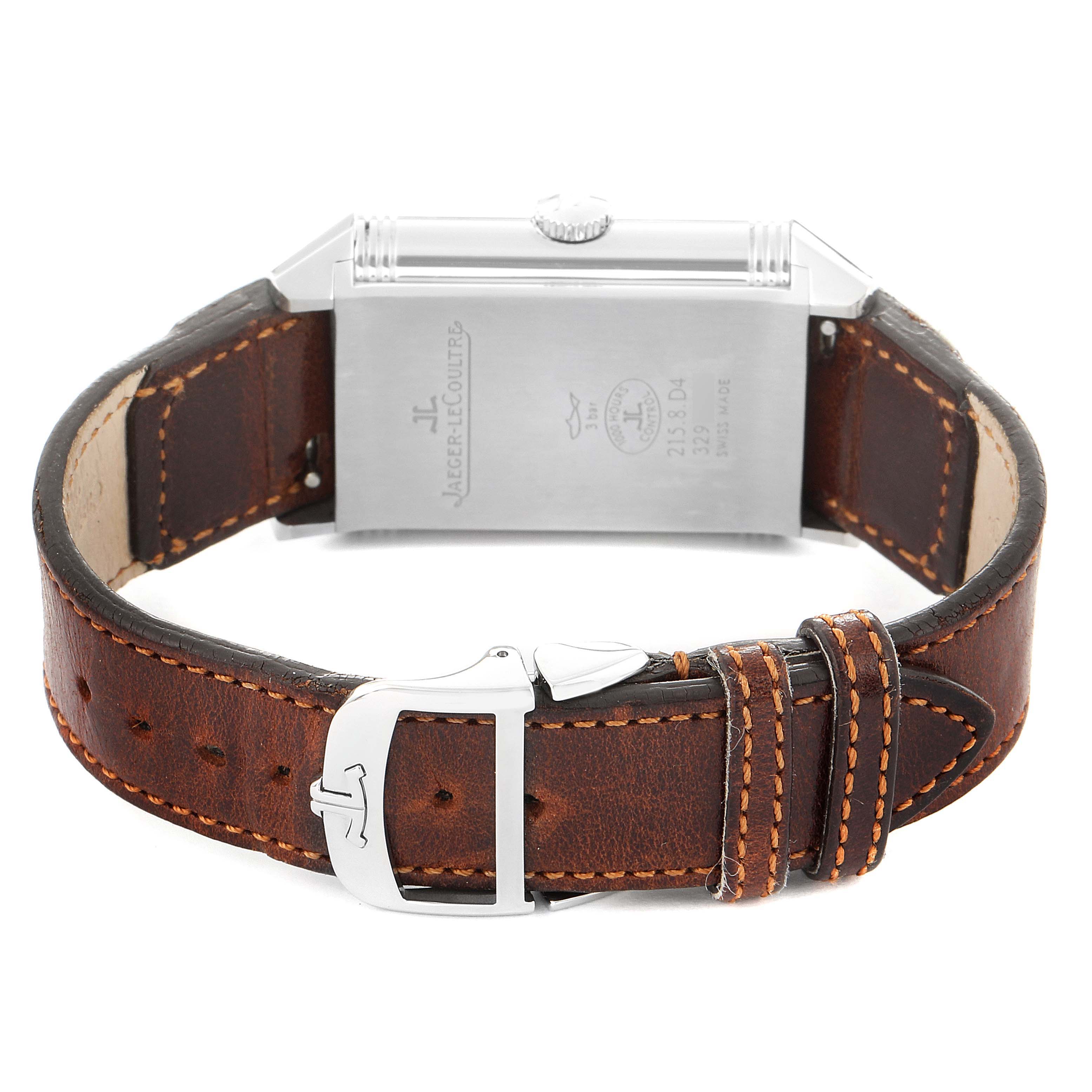 This image shows the back of a Jaeger LeCoultre Reverso Q3848420 Men's Stainless Steel Silver Dial Q3848420 Men's Stainless Steel Silver Dial watch and its brown leather strap with a buckle.