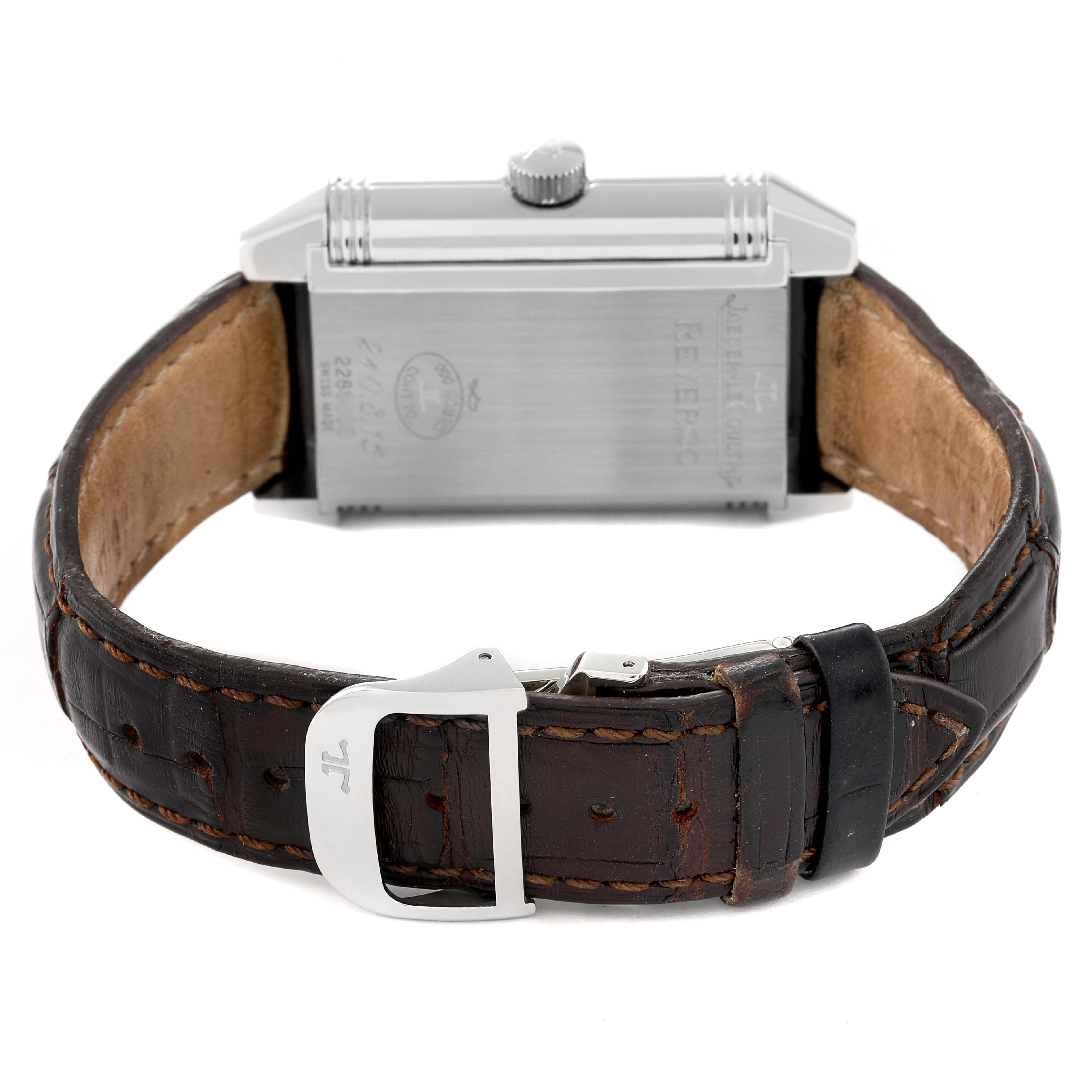 The image shows the back view of a Jaeger LeCoultre Reverso Q3008420 Men's Stainless Steel Silver Dial Q3008420 Men's Stainless Steel Silver Dial watch with a leather strap and a visible buckle.
