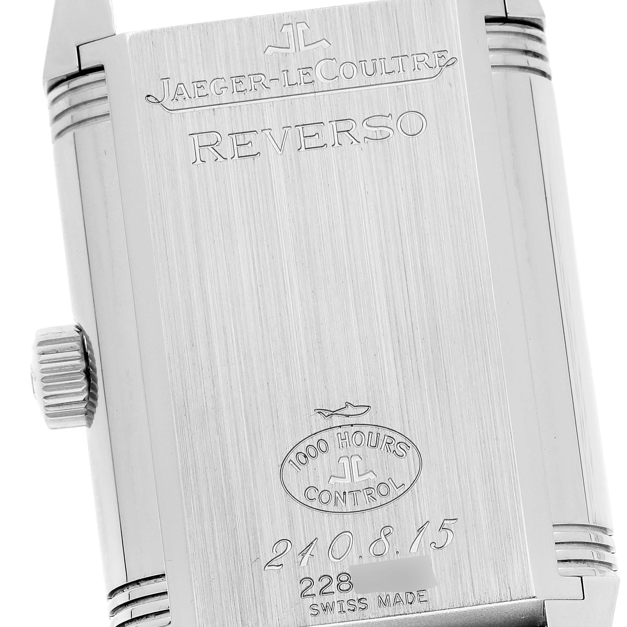 This image shows the back casing of a Jaeger-LeCoultre Reverso watch at a slight angle, highlighting the engraved details.