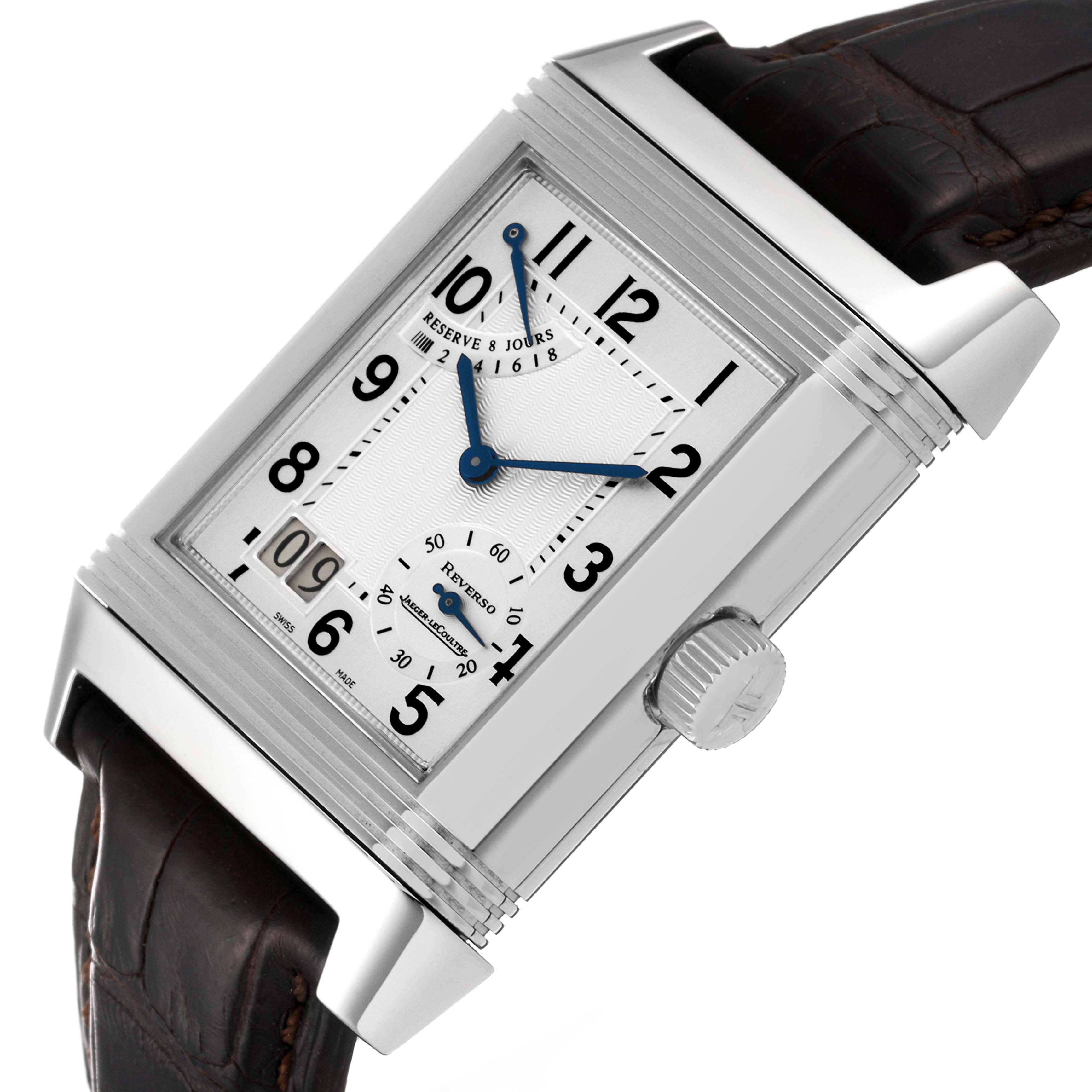 The image shows a close-up view of the Jaeger-LeCoultre Reverso watch face and brown leather strap at an angle.