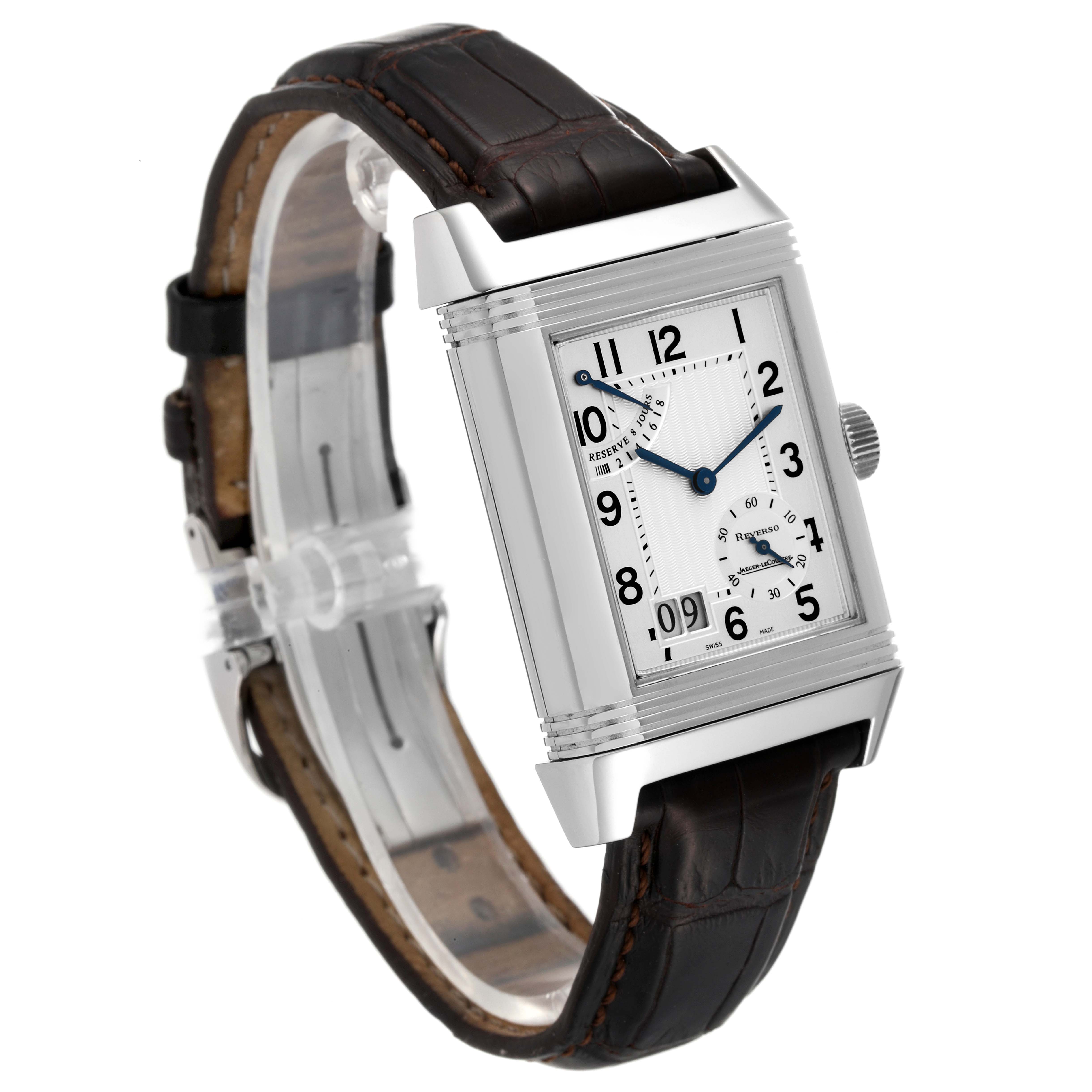 The image shows a Jaeger-LeCoultre Reverso watch at a three-quarter angle, highlighting its rectangular face, crown, and dark leather strap.