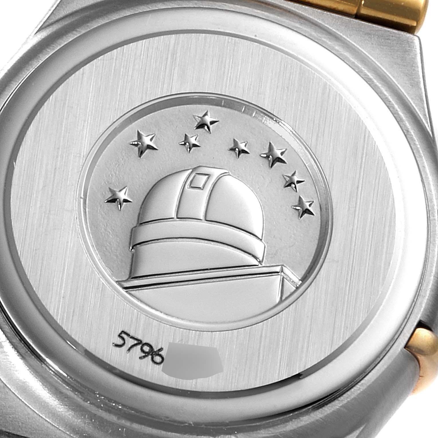 This image shows the back case of the Omega 1267.75.00 Women's Steel and Gold (two tone) Mother of Pearl Dial 1267.75.00 Women's Steel and Gold (two tone) Mother of Pearl Dial Constellation 95 Mother of Pearl Diamond Watch 1267.75.00, featuring an engraved observatory and stars.