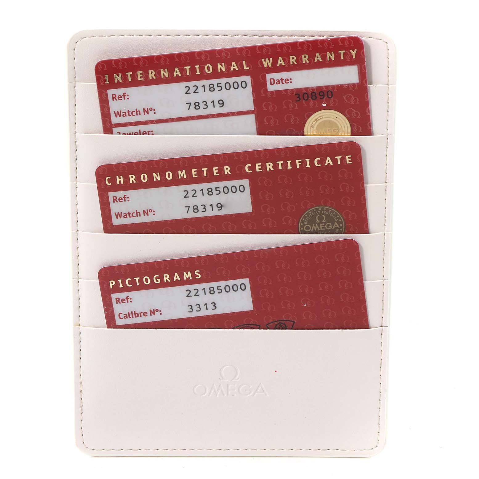 The image shows the International Warranty, Chronometer Certificate, and Pictograms cards for an Omega Planet Ocean 2218.50.00 Men's Stainless Steel Black Dial 2218.50.00 Men's Stainless Steel Black Dial watch in a white holder.