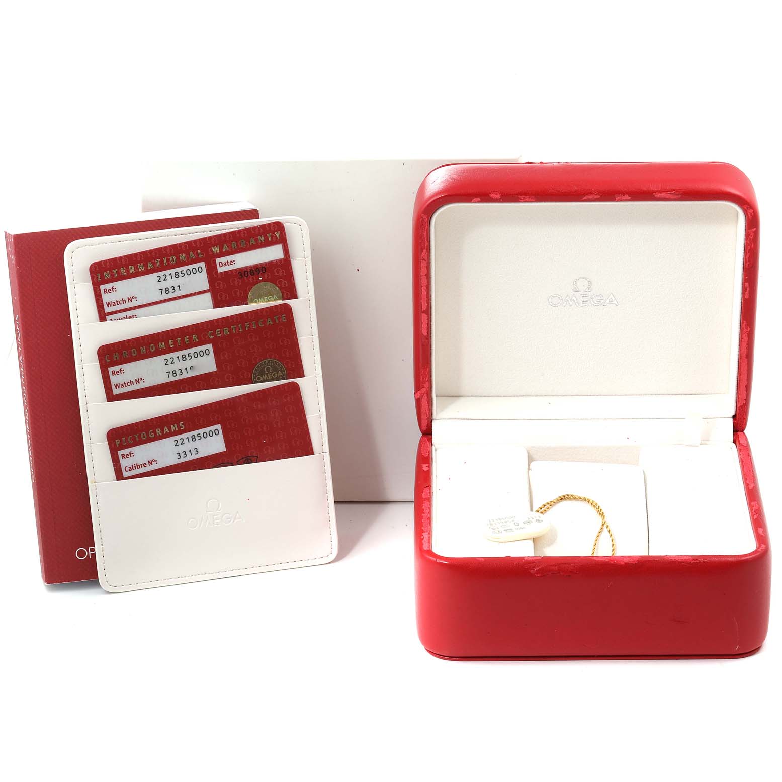 The image shows an Omega Planet Ocean 2218.50.00 Men's Stainless Steel Black Dial 2218.50.00 Men's Stainless Steel Black Dial watch box, warranty cards, and a tag from a front angle.