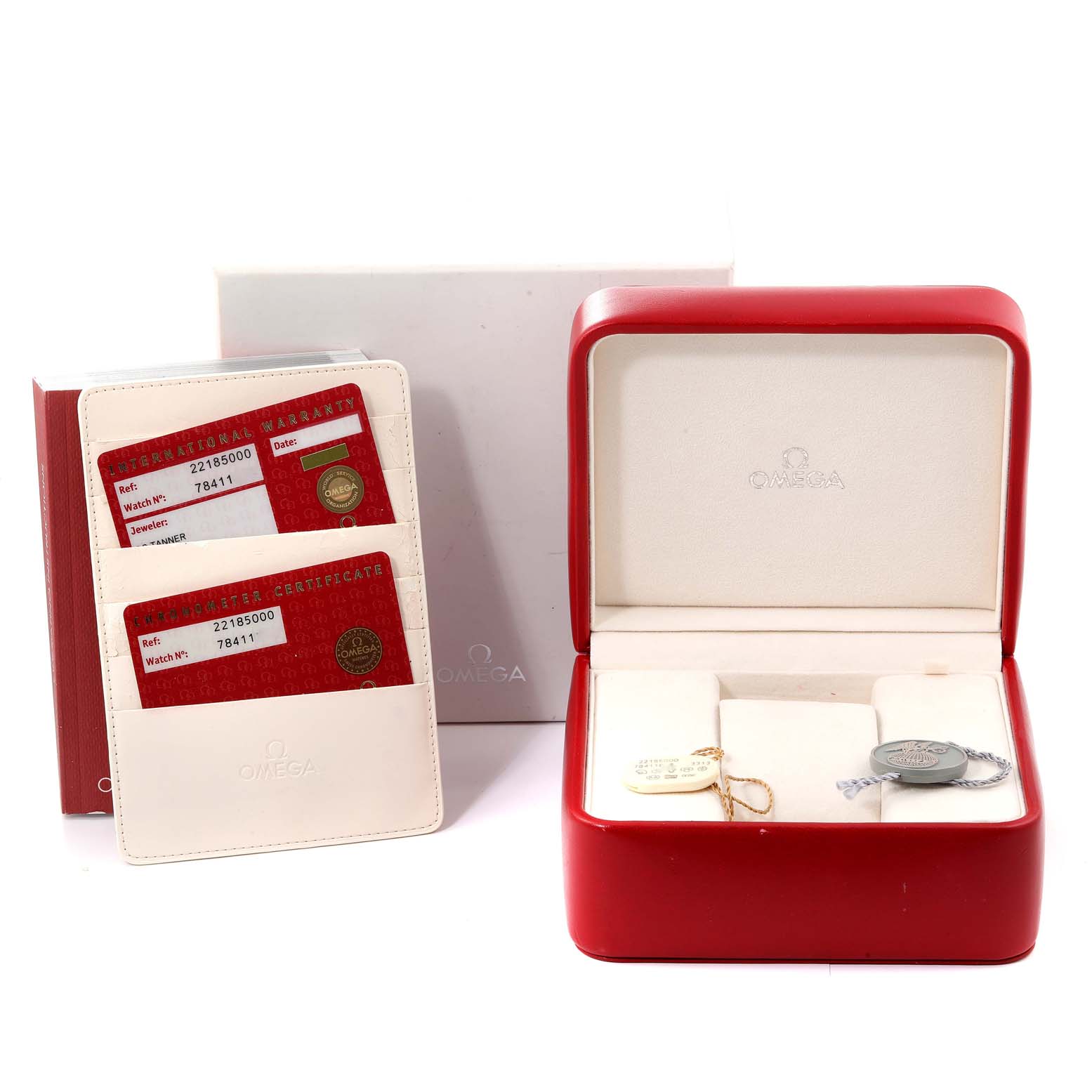 The image shows the packaging and accessories for the Omega Planet Ocean 2218.50.00 Men
s Stainless Steel Black Dial 2218.50.00 Men
s Stainless Steel Black Dial model, including the red watch box and warranty cards.