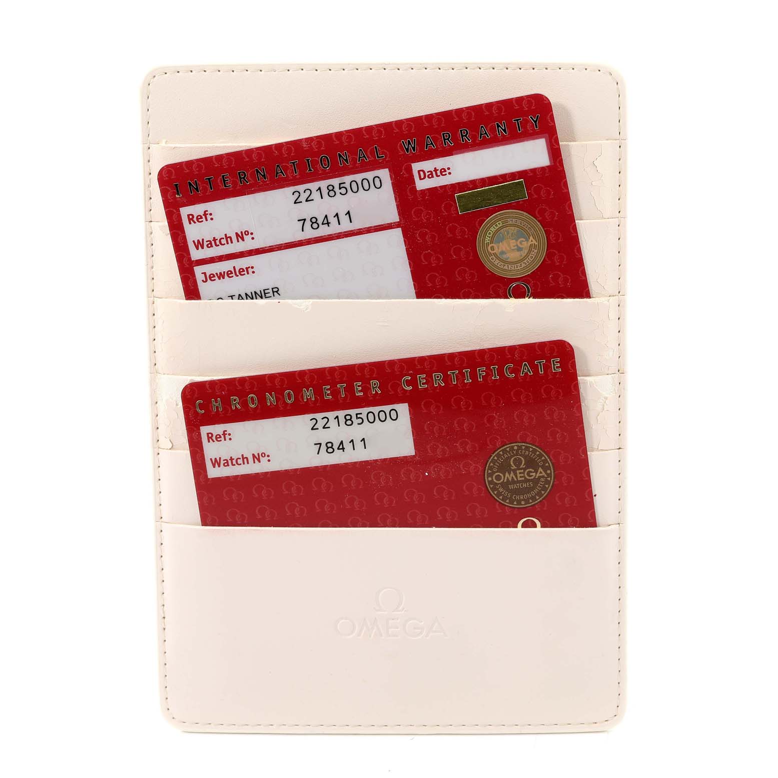 The image shows the warranty and chronometer certificate cards for an Omega Planet Ocean 2218.50.00 Men
s Stainless Steel Black Dial 2218.50.00 Men
s Stainless Steel Black Dial watch in a white cardholder.