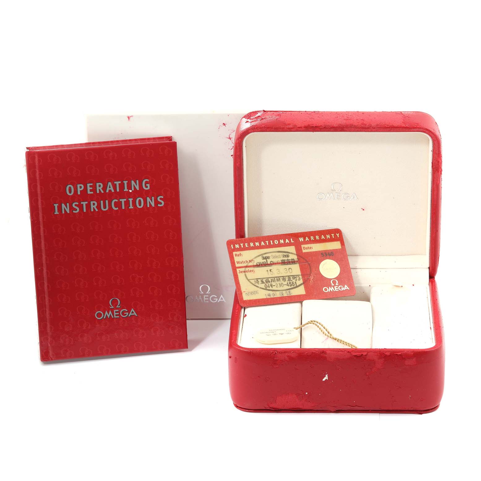 This image shows an Omega Speedmaster 3520.50.00 Men's Stainless Steel Black Dial 3520.50.00 Men's Stainless Steel Black Dial watch's operating instructions, warranty card, and a red watch box.