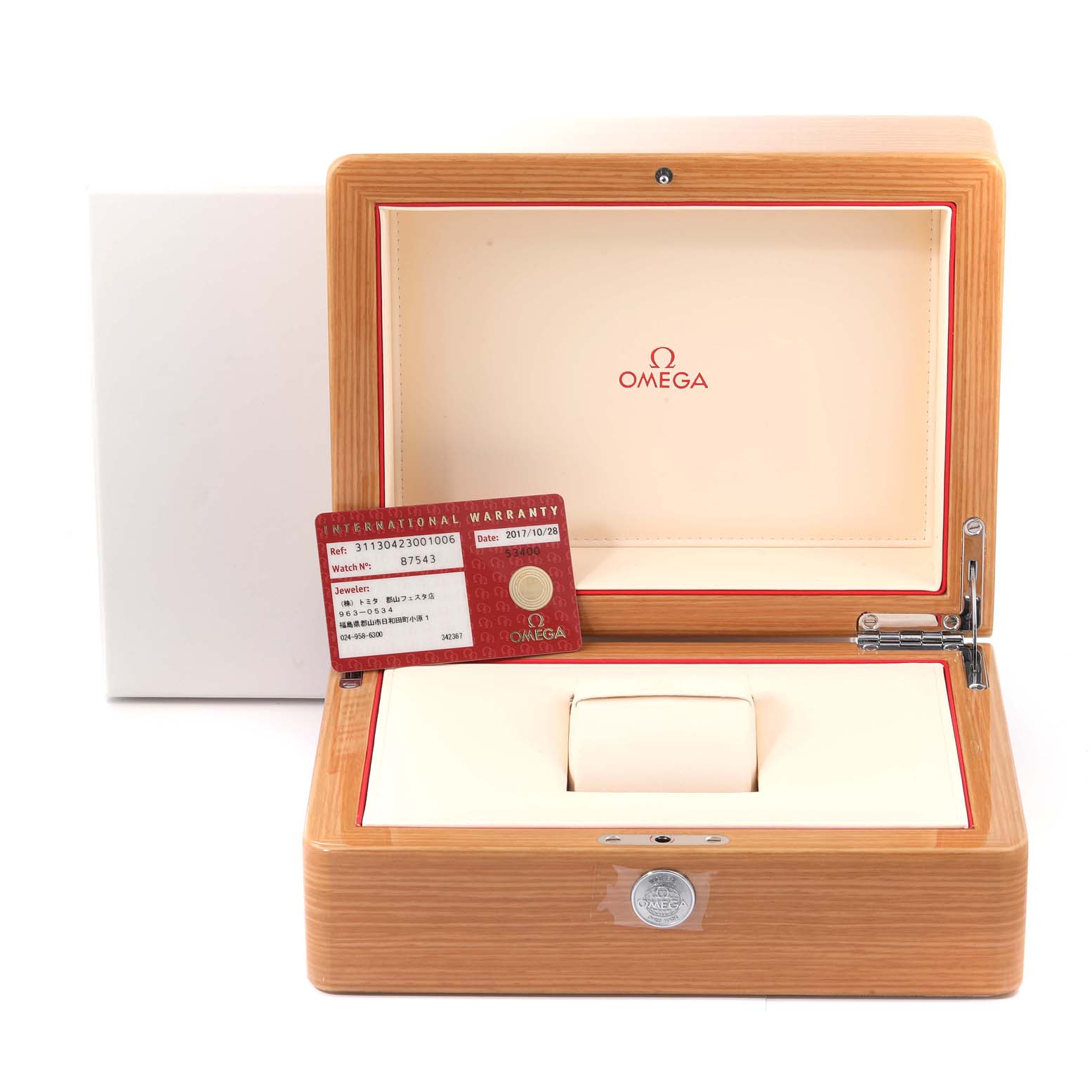 The image shows the open wooden box of an Omega Speedmaster 311.30.42.30.01.006 Men's Stainless Steel Black Dial 311.30.42.30.01.006 Men's Stainless Steel Black Dial, featuring its warranty card placed inside.