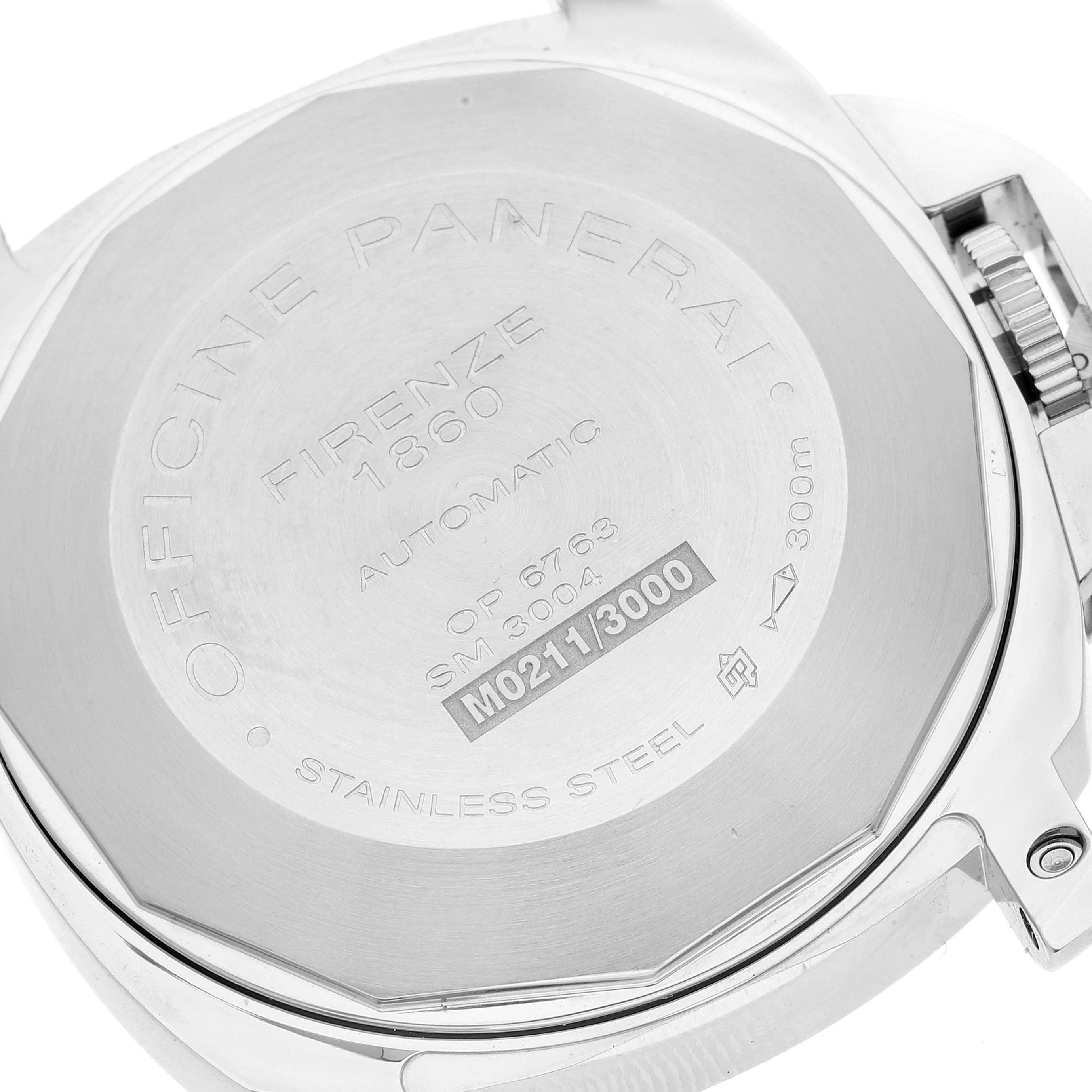 The image shows the case back of a Panerai Luminor PAM00104 Men
s Stainless Steel Black Dial PAM00104 Men
s Stainless Steel Black Dial watch, revealing engravings and a visible locking mechanism.