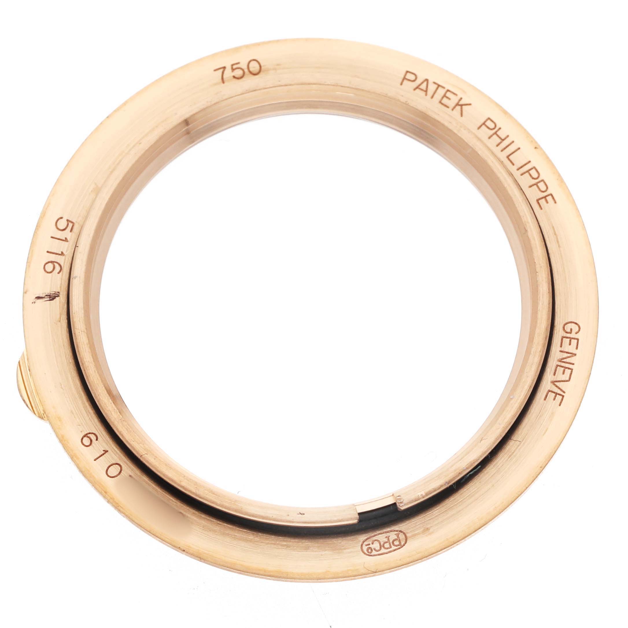 The image shows a top-down view of a Patek Philippe Calatrava 5116R Men's Rose Gold White Dial bezel with engravings.