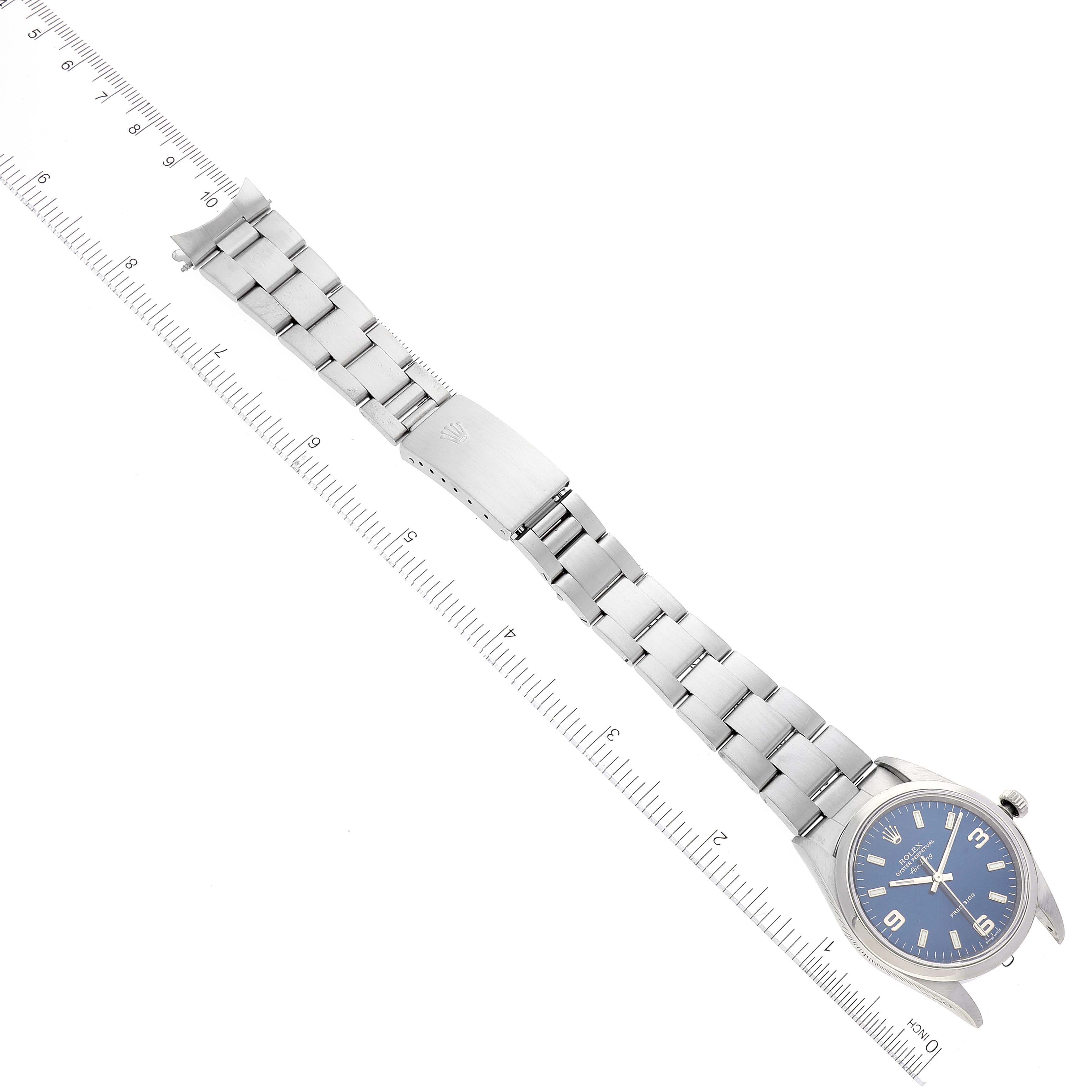 The image shows a top-down view of a Rolex Air-King 14000 Men's Stainless Steel Blue Dial 14000 Men's Stainless Steel Blue Dial watch, featuring its metal bracelet and clasp, with rulers for scale.