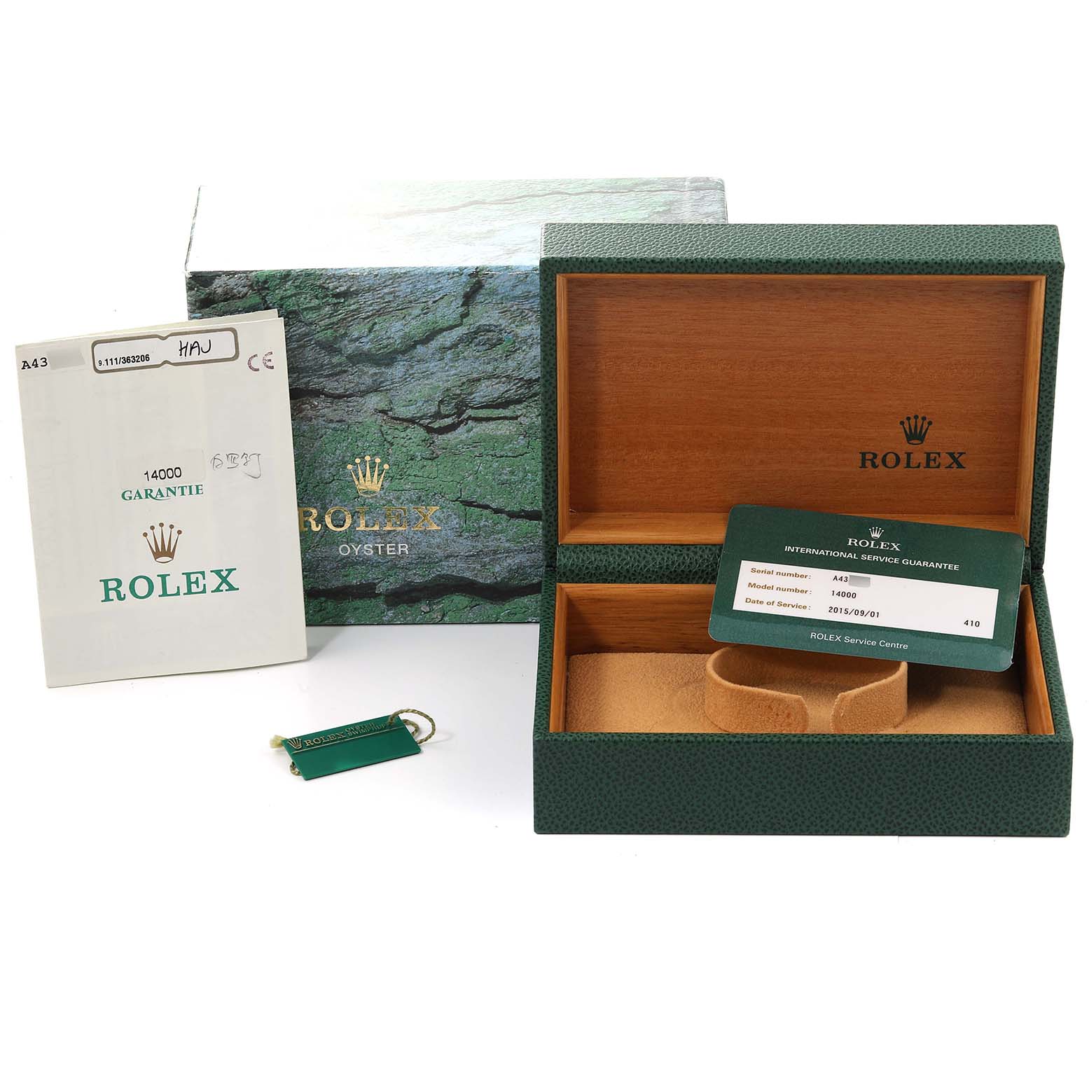 The image shows an open Rolex Air-King 14000 Men's Stainless Steel White Dial 14000 Men's Stainless Steel White Dial watch box with a booklet, international service guarantee card, and tags.