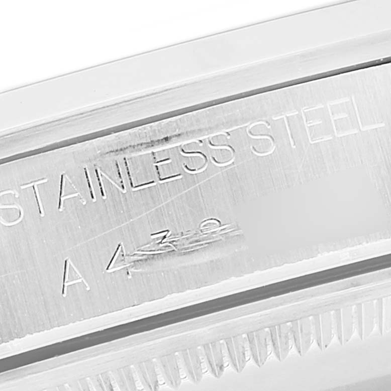 This image shows a close-up angle of the case side engraving on a Rolex Air-King 14000 Men's Stainless Steel White Dial 14000 Men's Stainless Steel White Dial watch, highlighting the material and part of the serial number.