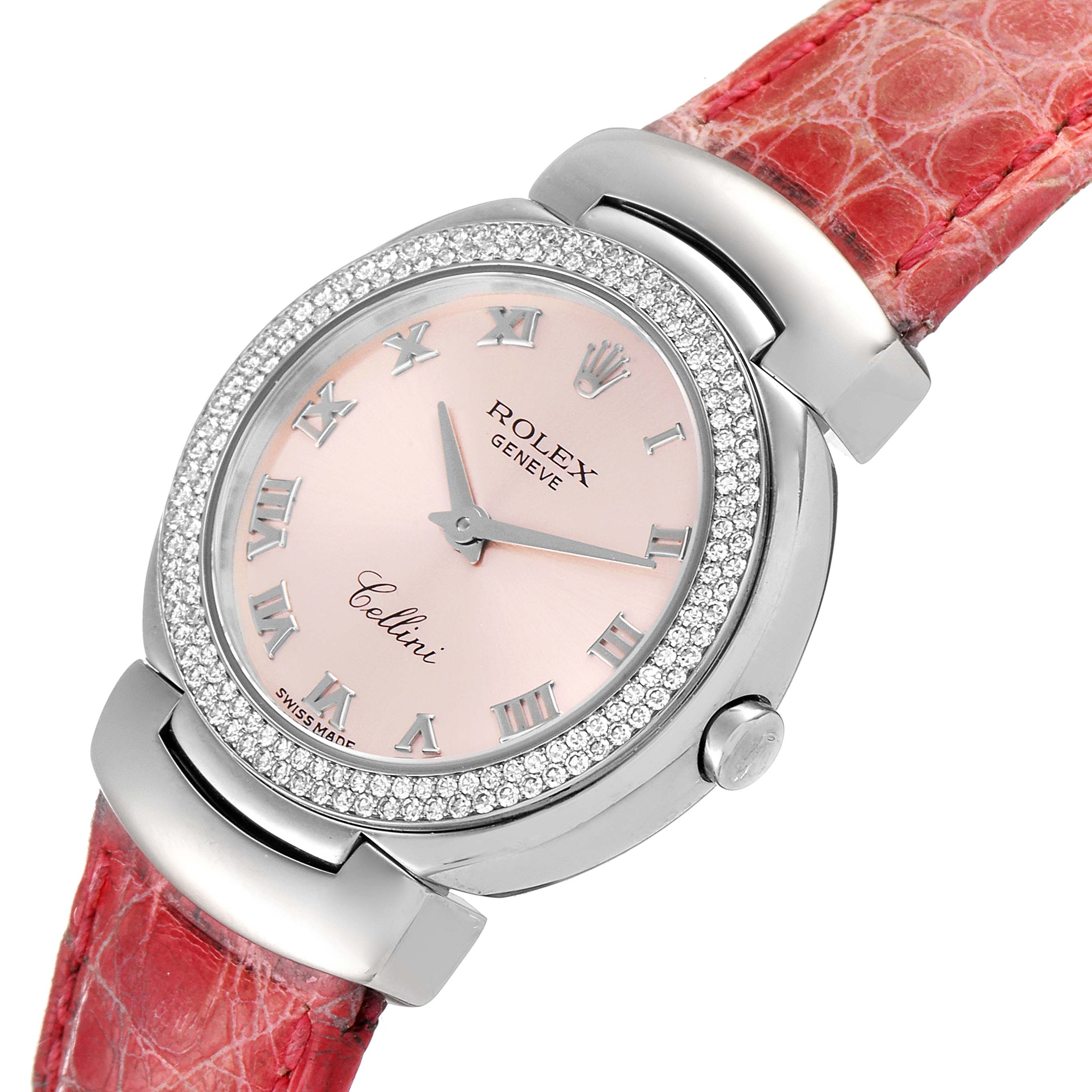 The Rolex Cellini 6671 Women's White Gold Pink Dial 6671 Women's White Gold Pink Dial watch is shown at an oblique angle, highlighting the dial, bezel, crown, and red leather strap.