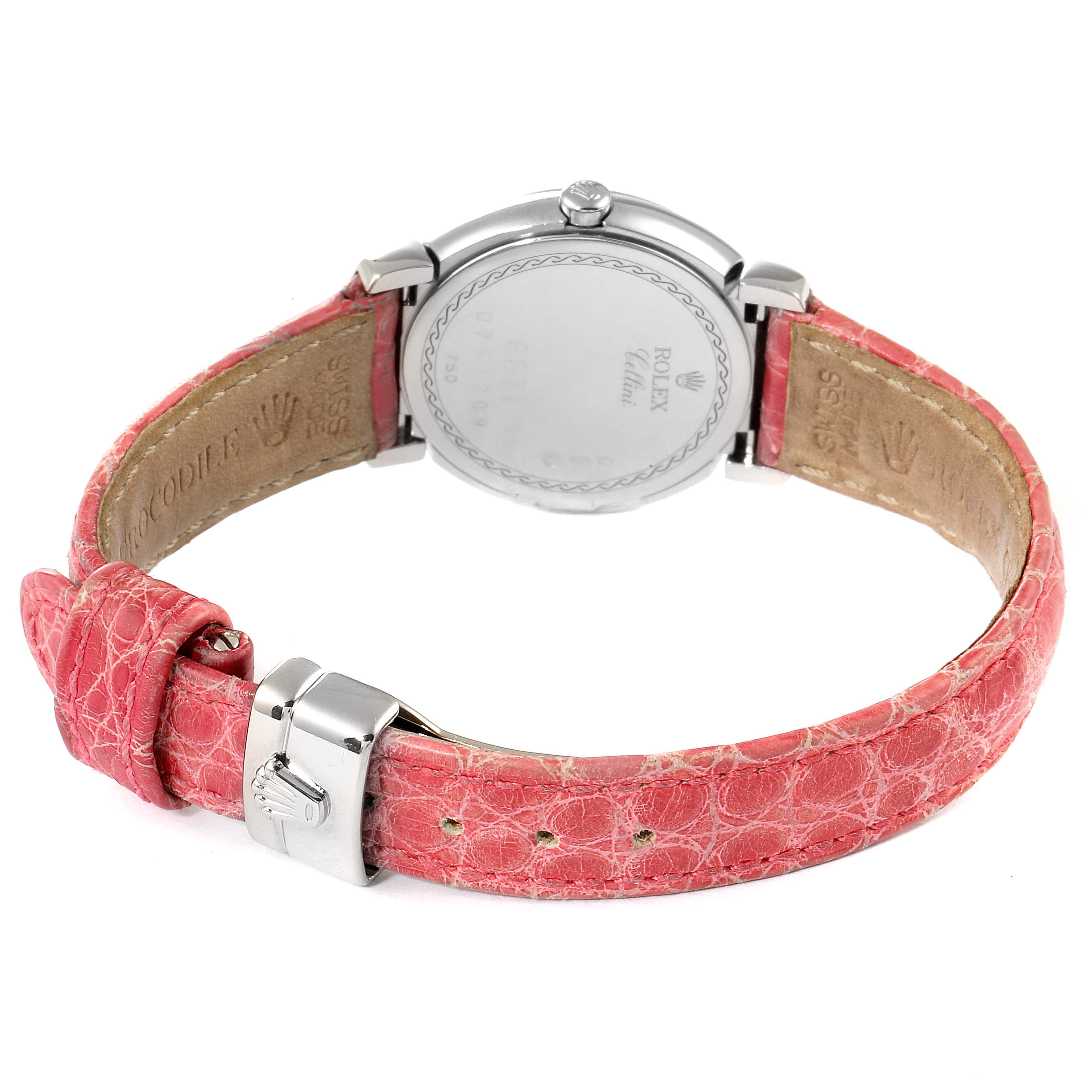 The image shows the back of a Rolex Cellini 6671 Women's White Gold Pink Dial 6671 Women's White Gold Pink Dial watch and its pink leather strap and silver buckle.
