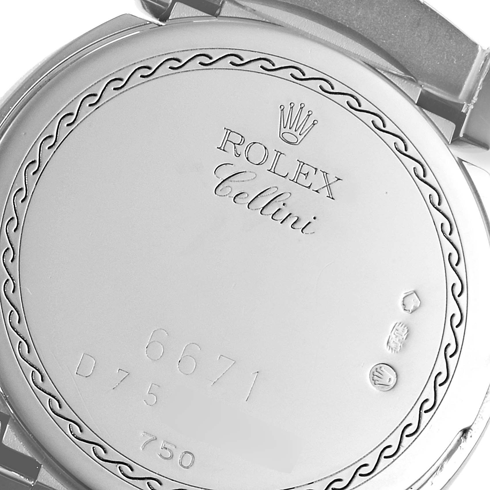 This is a close-up view of the back case of a Rolex Cellini 6671 Women's White Gold Pink Dial 6671 Women's White Gold Pink Dial watch, showcasing its engravings and hallmarks.