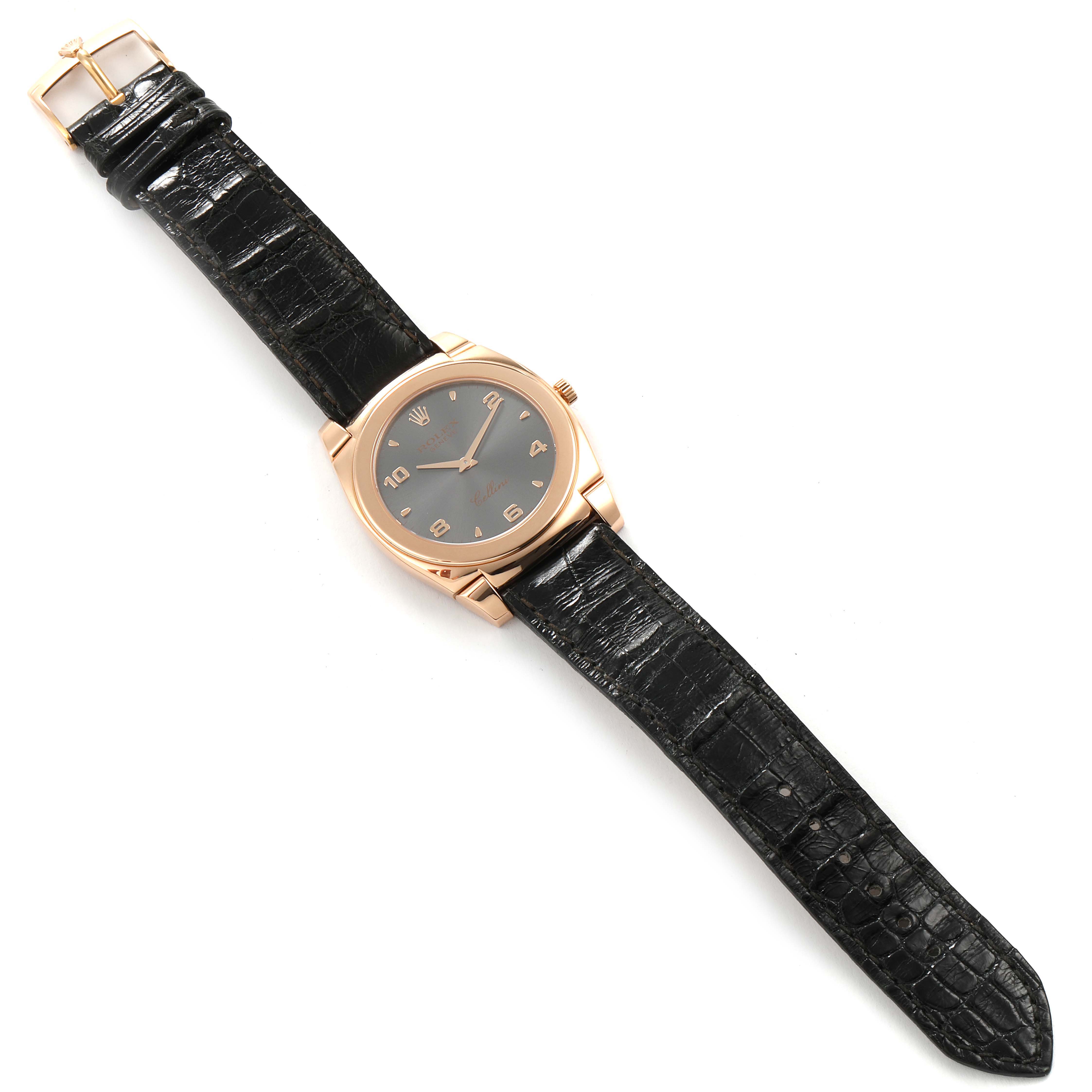 The image shows a top-down view of a Rolex Cellini 5330 Men's Rose Gold Grey Dial 5330 Men's Rose Gold Grey Dial watch with a black dial and a black leather strap.