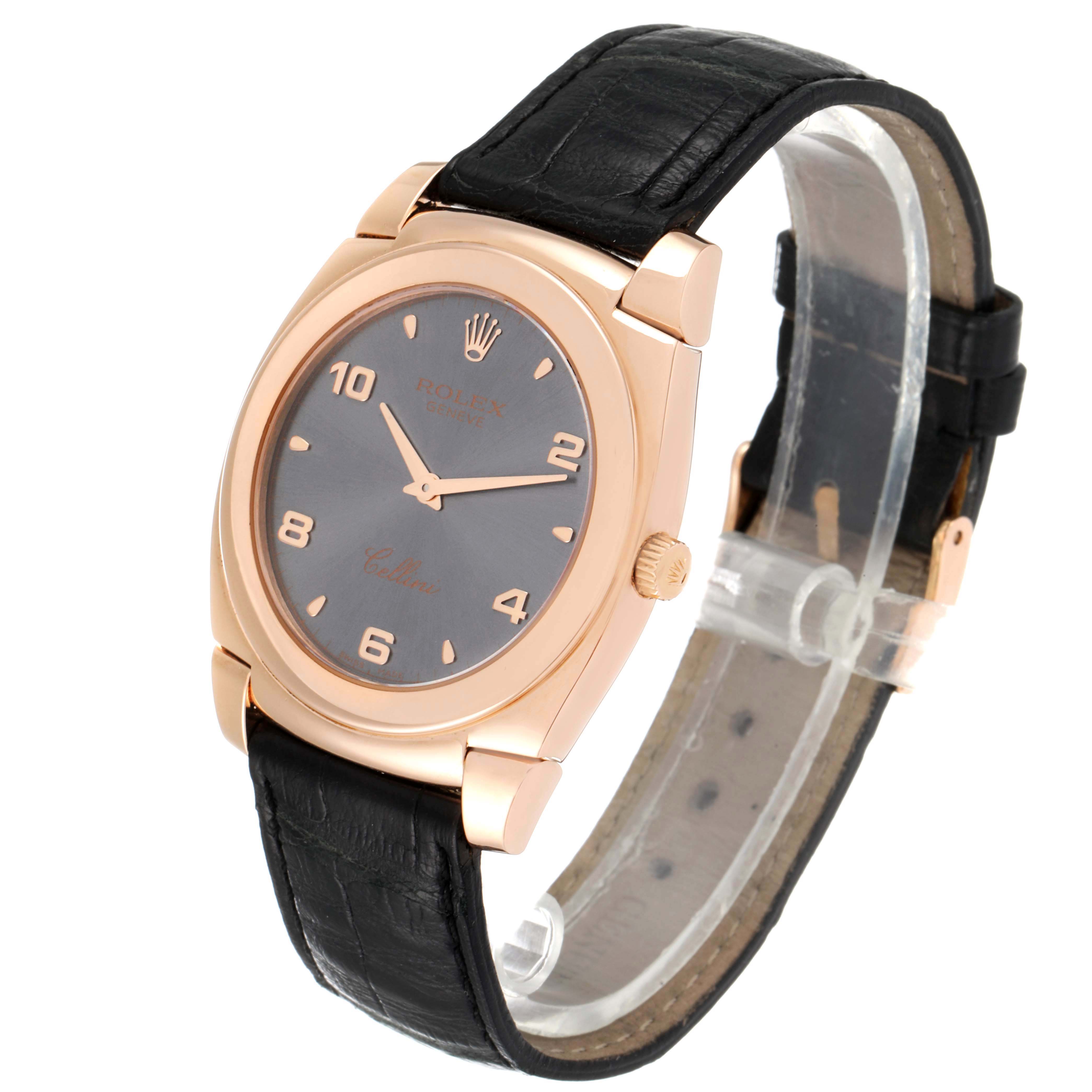 The Rolex Cellini 5330 Men's Rose Gold Grey Dial 5330 Men's Rose Gold Grey Dial watch is shown at a slightly tilted angle, displaying its face, case, crown, and leather strap.