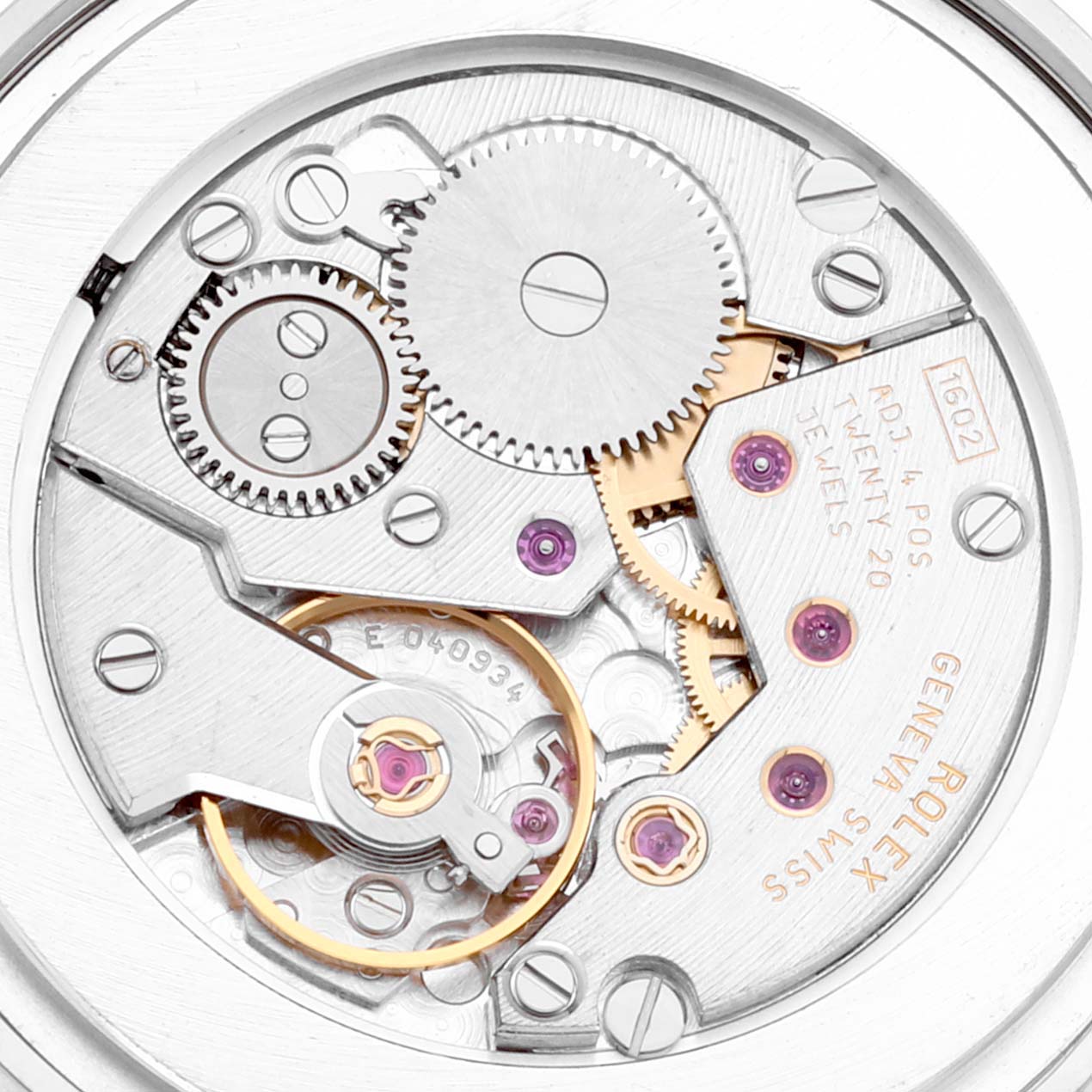 This close-up image of the Rolex Cellini 5116 Men's White Gold Beige Dial 5116 Men's White Gold Beige Dial model shows the inner mechanical movement and gears from the back.