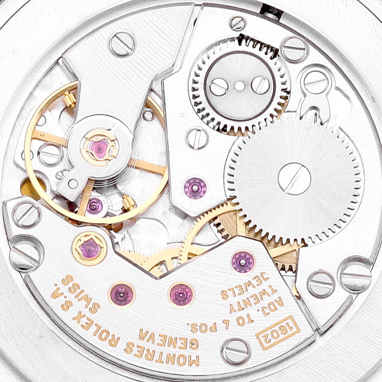 This close-up image shows the intricate inner mechanical components of a Rolex Cellini 4233 Men
s White Gold Black Dial 4233 Men
s White Gold Black Dial watch, including gears and jewel bearings.