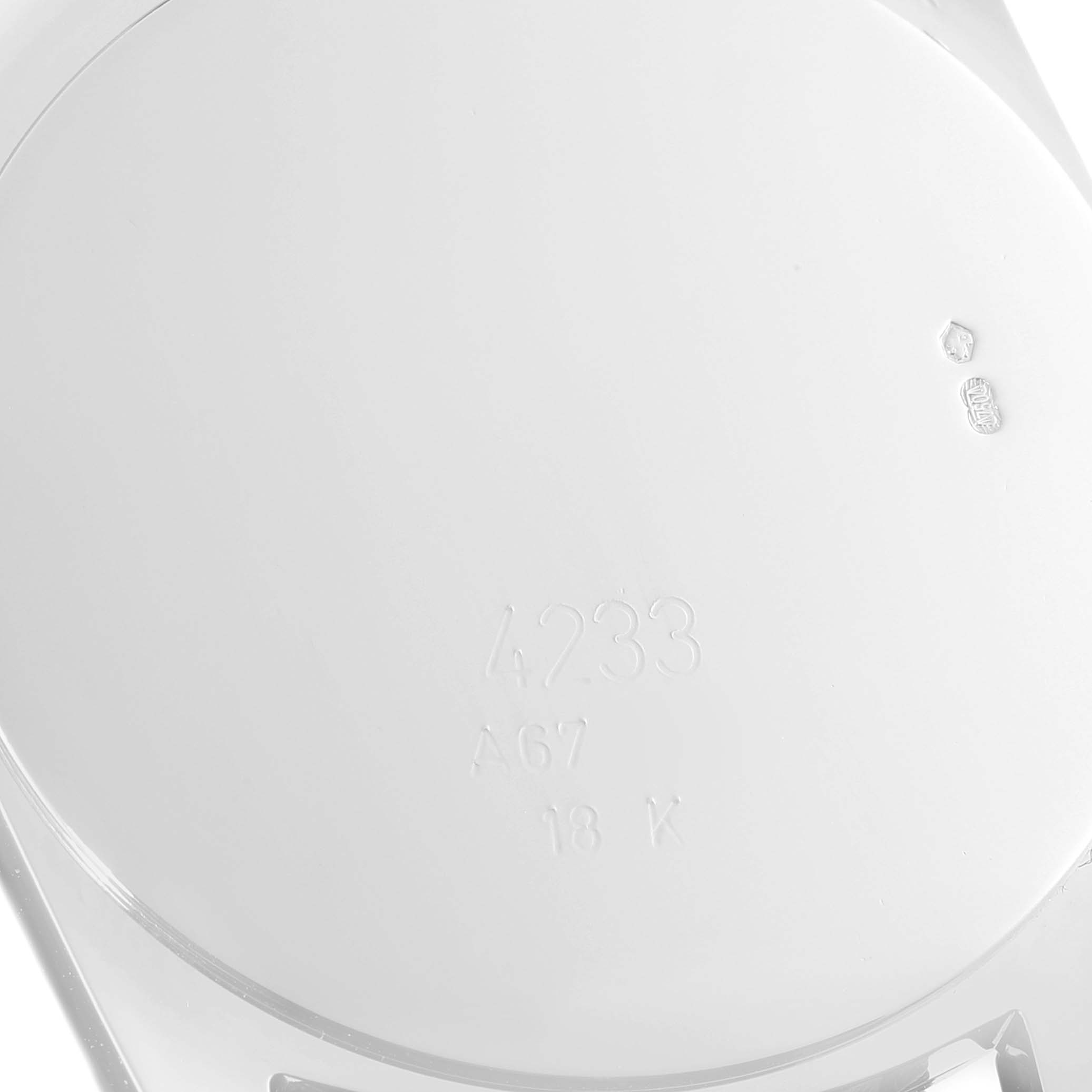 This image shows the back casing of a Rolex Cellini 4233 Men
s White Gold Black Dial 4233 Men
s White Gold Black Dial watch, displaying model number and 18K gold markings.