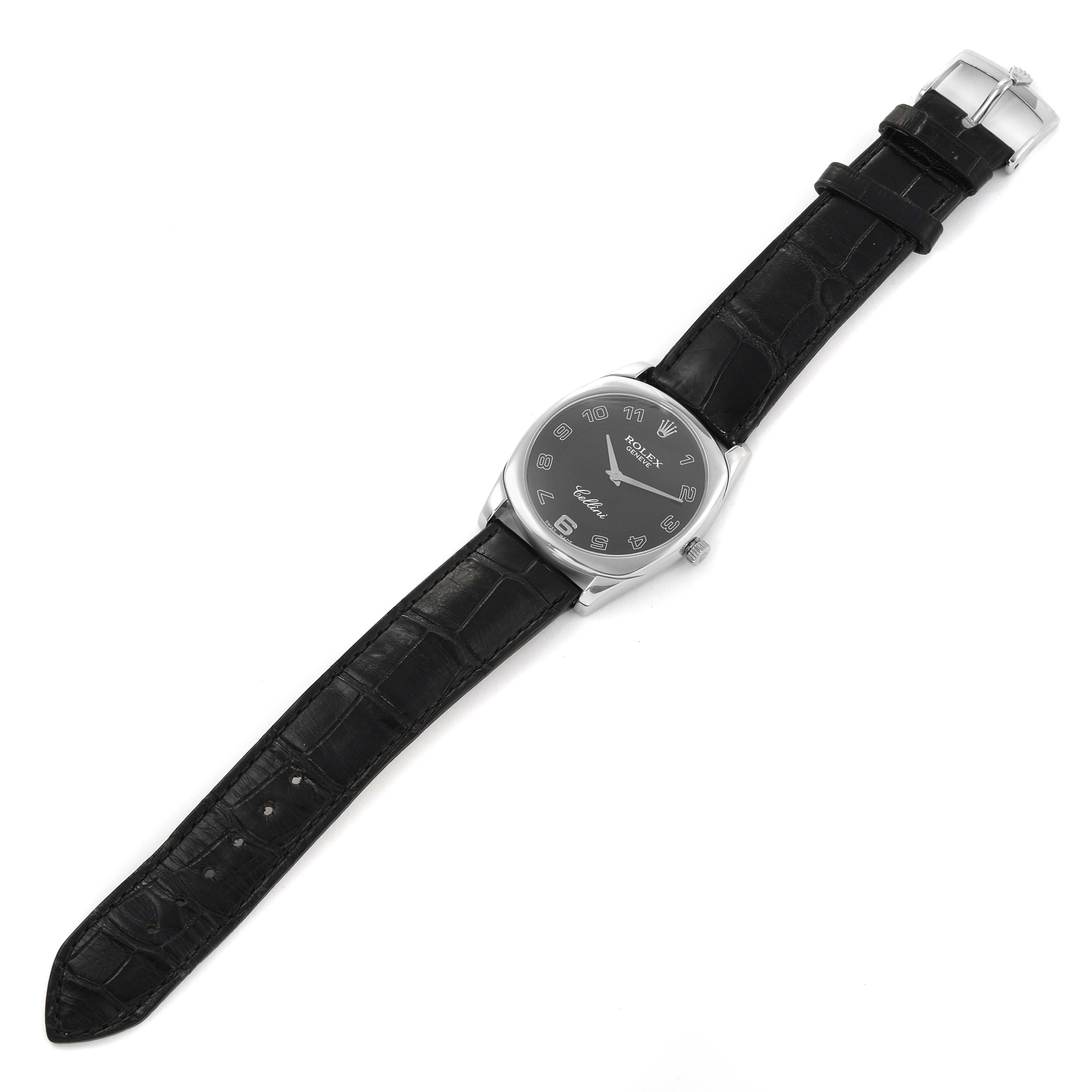 This image shows a Rolex Cellini 4233 Men
s White Gold Black Dial 4233 Men
s White Gold Black Dial watch laid flat, displaying the face, case, black leather strap, and buckle from a top view.