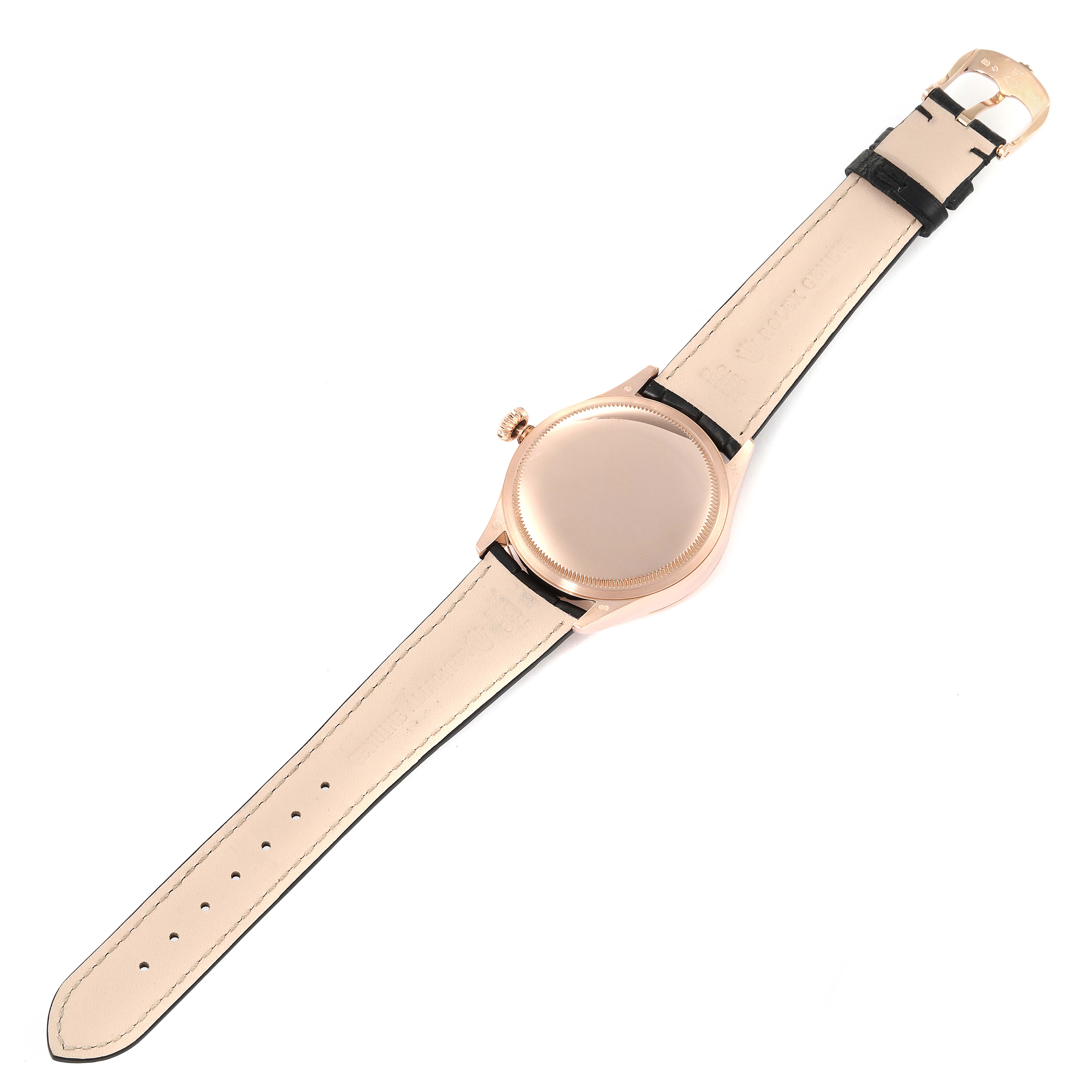 The Rolex Cellini 50515 Men
s Rose Gold Silver Dial 50515 Men
s Rose Gold Silver Dial watch is shown from the back, highlighting its leather strap and clasp.