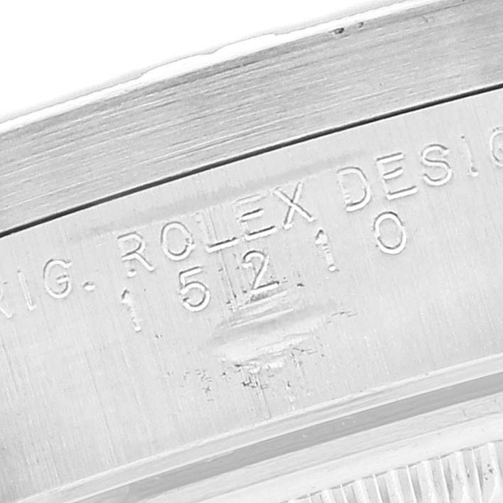 This image shows the engraved model number portion of a Rolex Date 15210 Men's Stainless Steel Black Dial 15210 Men's Stainless Steel Black Dial watch caseback.