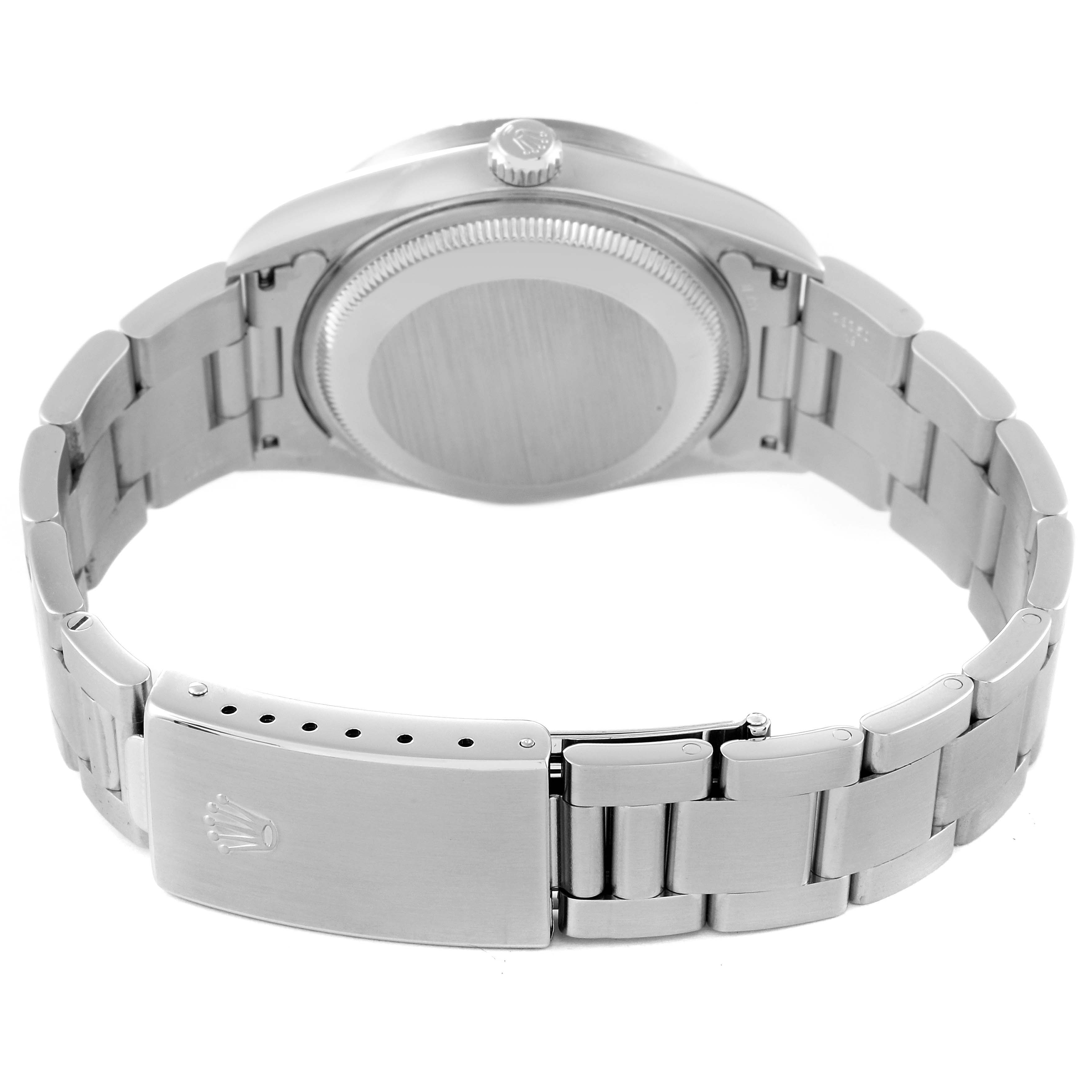 The image shows a rear view of a Rolex Date 15210 Men's Stainless Steel Black Dial 15210 Men's Stainless Steel Black Dial model watch, highlighting the clasp, bracelet, and case back.