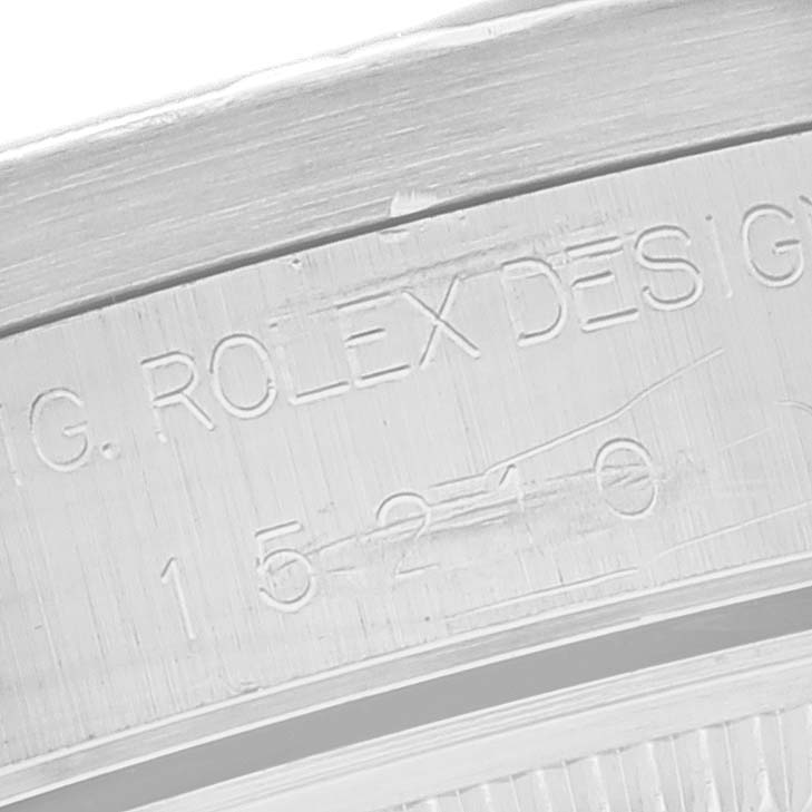 This image shows a close-up angle of the model number engraving on the case of a Rolex Date 15210 Men's Stainless Steel White Dial 15210 Men's Stainless Steel White Dial watch.