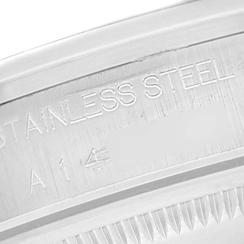 This image shows a close-up of the stainless steel case back with engravings on a Rolex Date 15200 Men's Stainless Steel White Dial 15200 Men's Stainless Steel White Dial model watch.